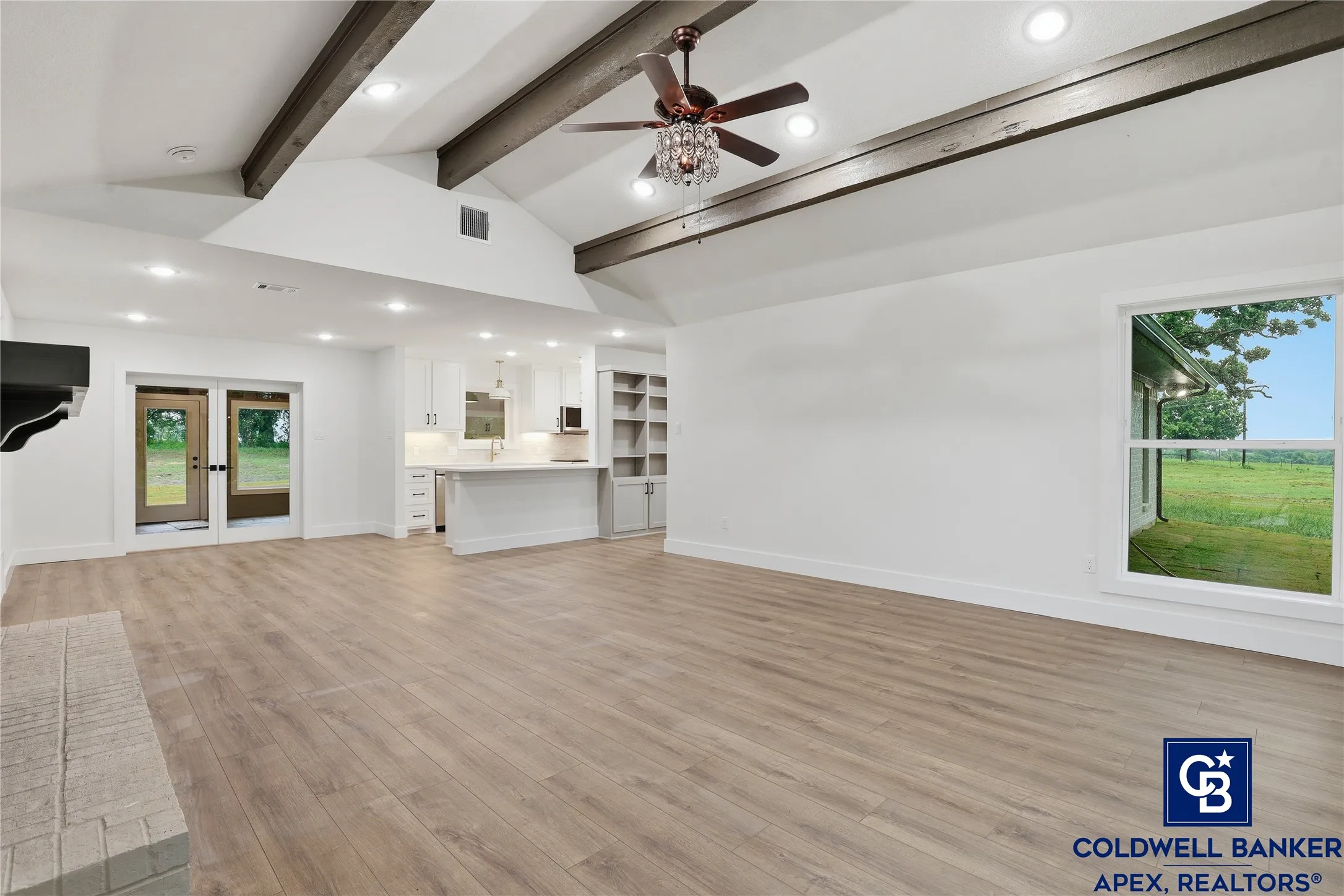 Spectacular picture floor-to-ceiling windows flood the home with natural light and frame incredible panoramic views of the acreage. Whether you’re entertaining or relaxing, this space is warm, inviting, and truly special.