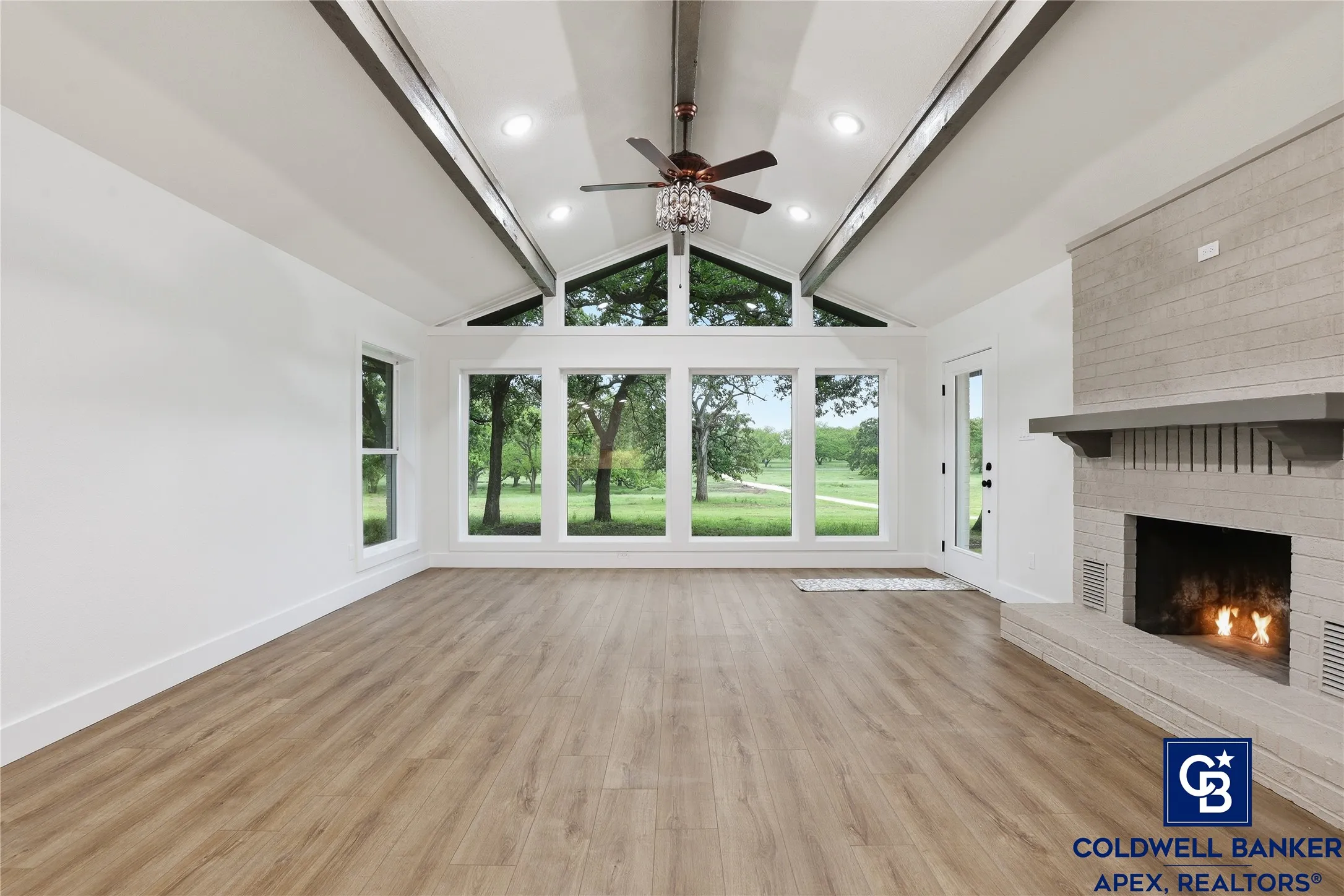 New flooring throughout completes the fresh, modern feel while maintaining the home’s charming character.