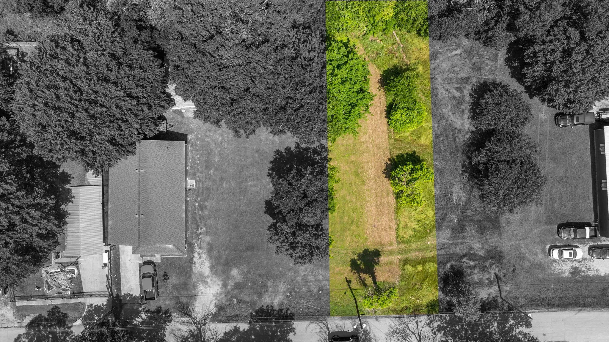 Long, rectangular parcel of land featuring a mix of cleared and treed areas