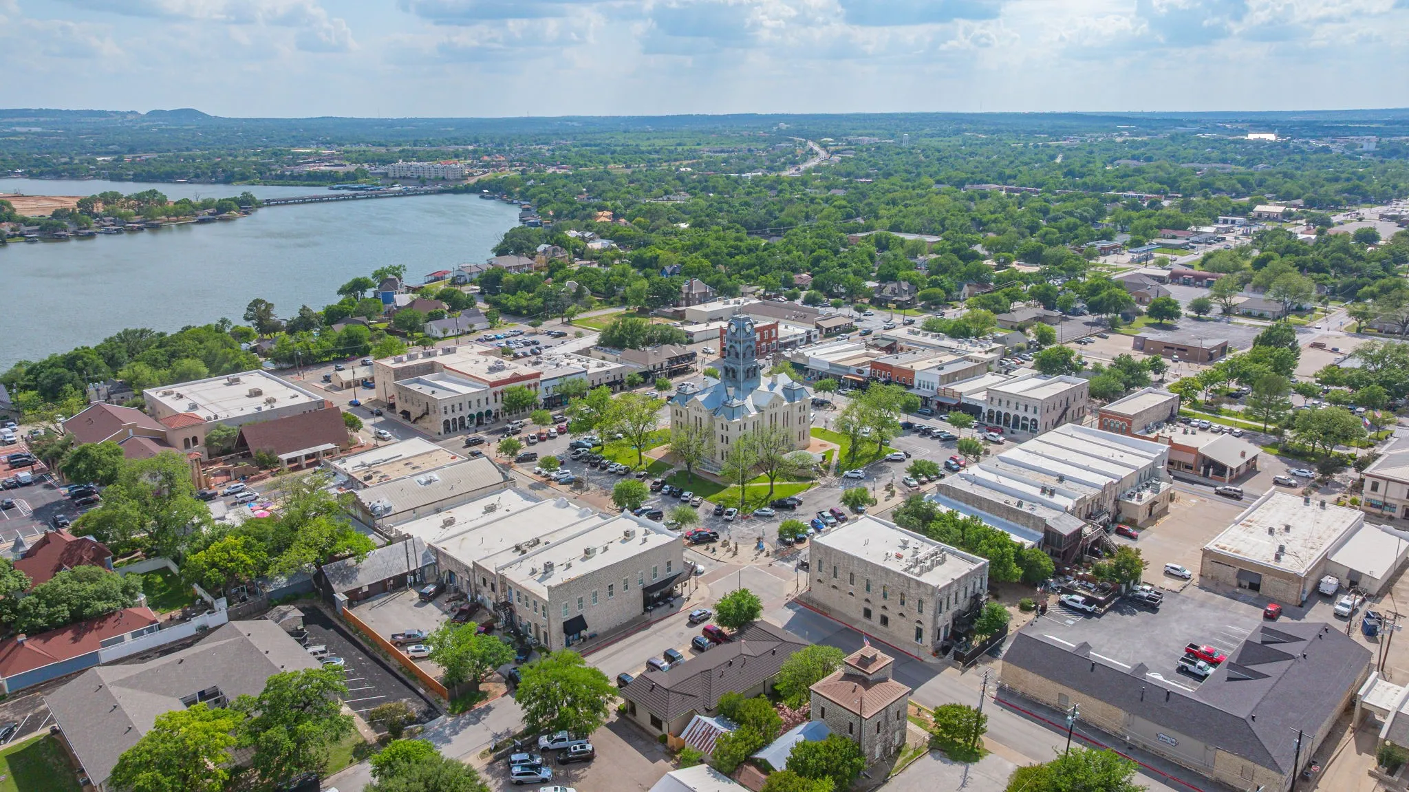 Aerial perspective of a vibrant downtown district featuring diverse commercial buildings