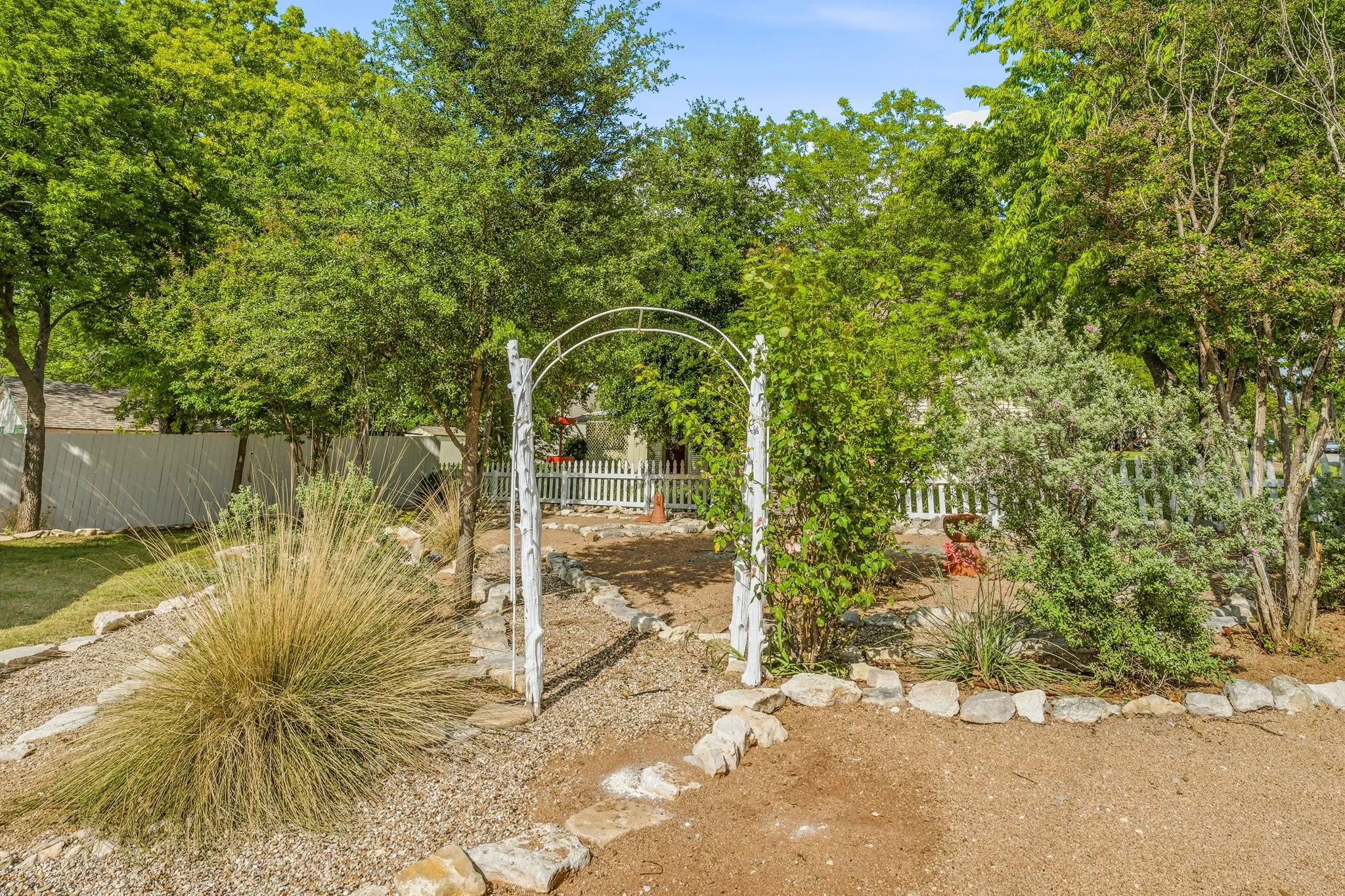 Landscaped pathway with decorative archway