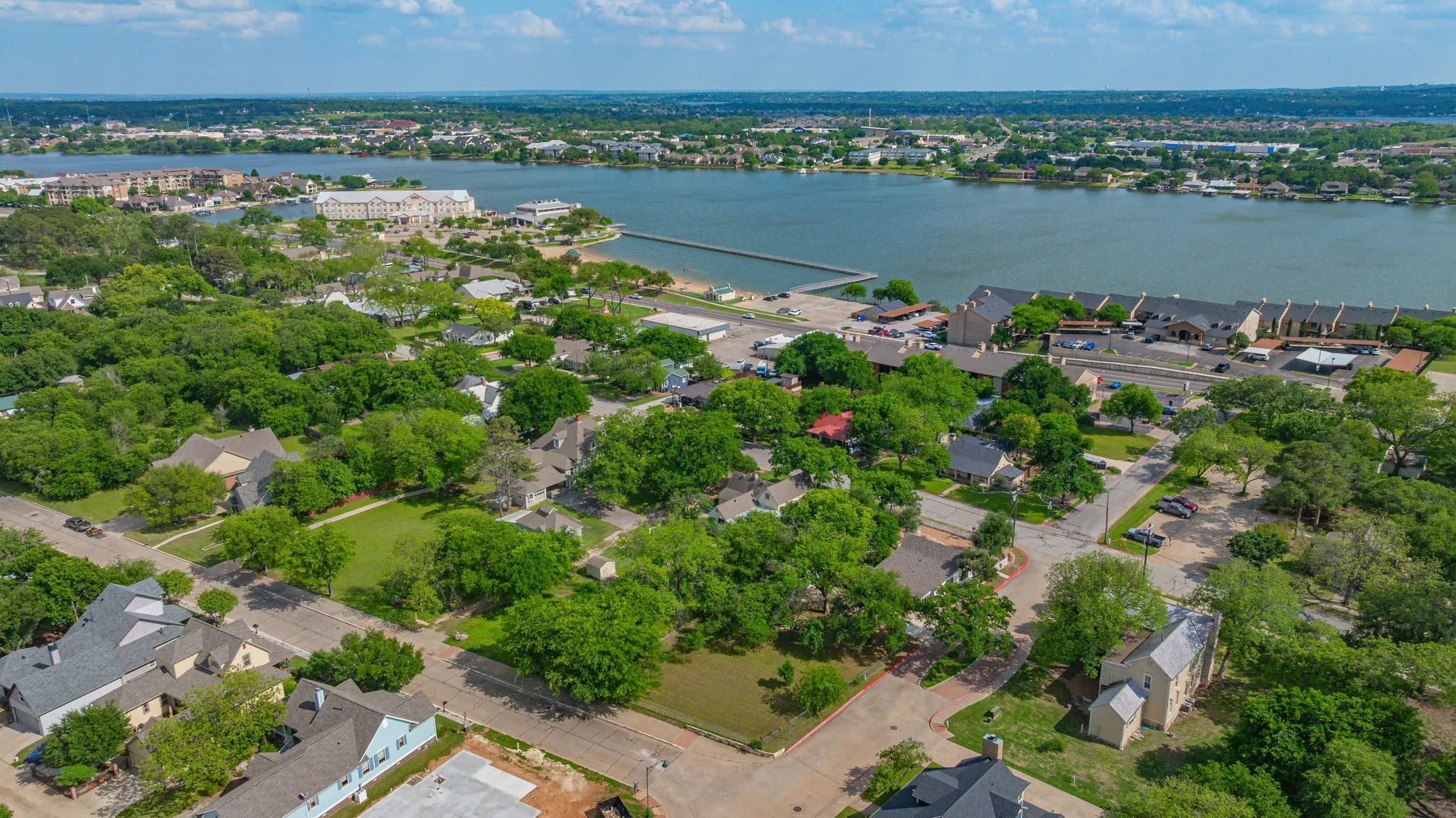 Aerial perspective showcasing a residential area with mature trees