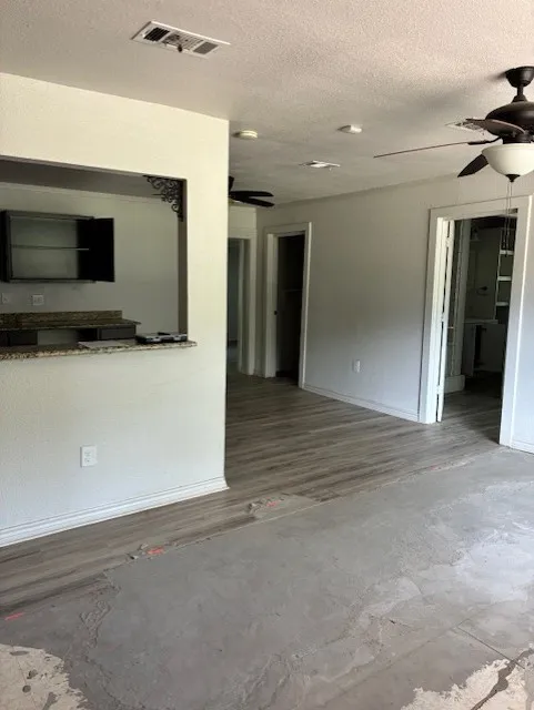Living room looking into eat in kitchen
