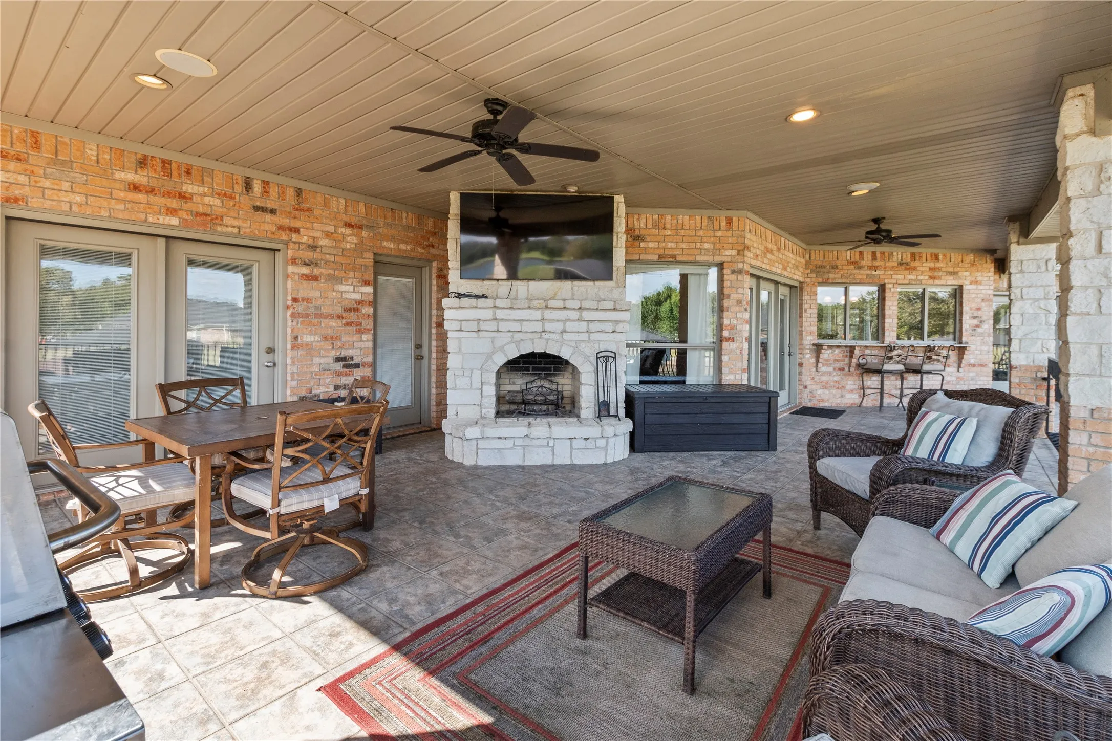 Covered patio with wood burning fireplace