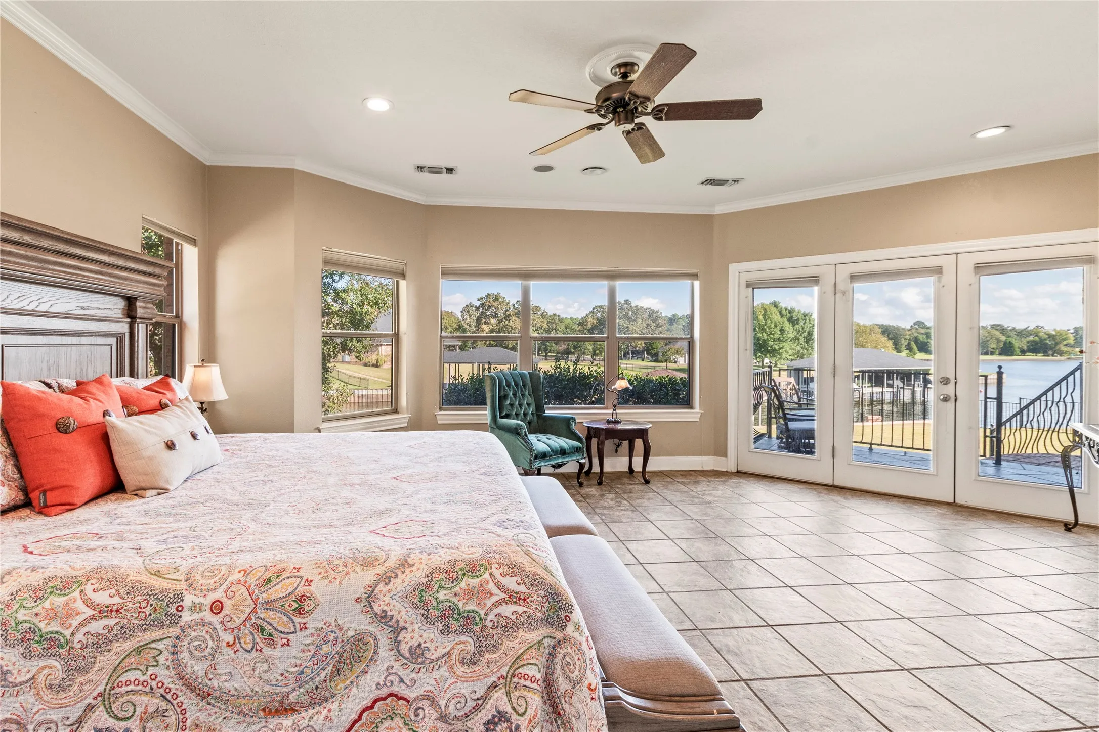 Water side primary bedroom with patio access