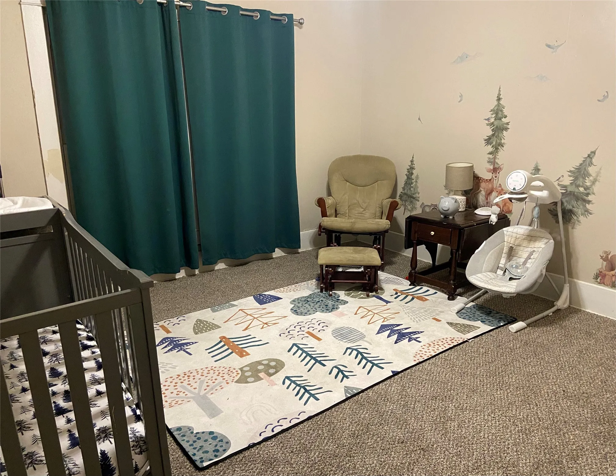 Neutral-toned wall paint complements the dark carpet flooring