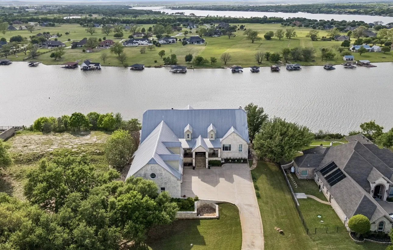 'Sunset hour aerial view of this incredible waterfront home