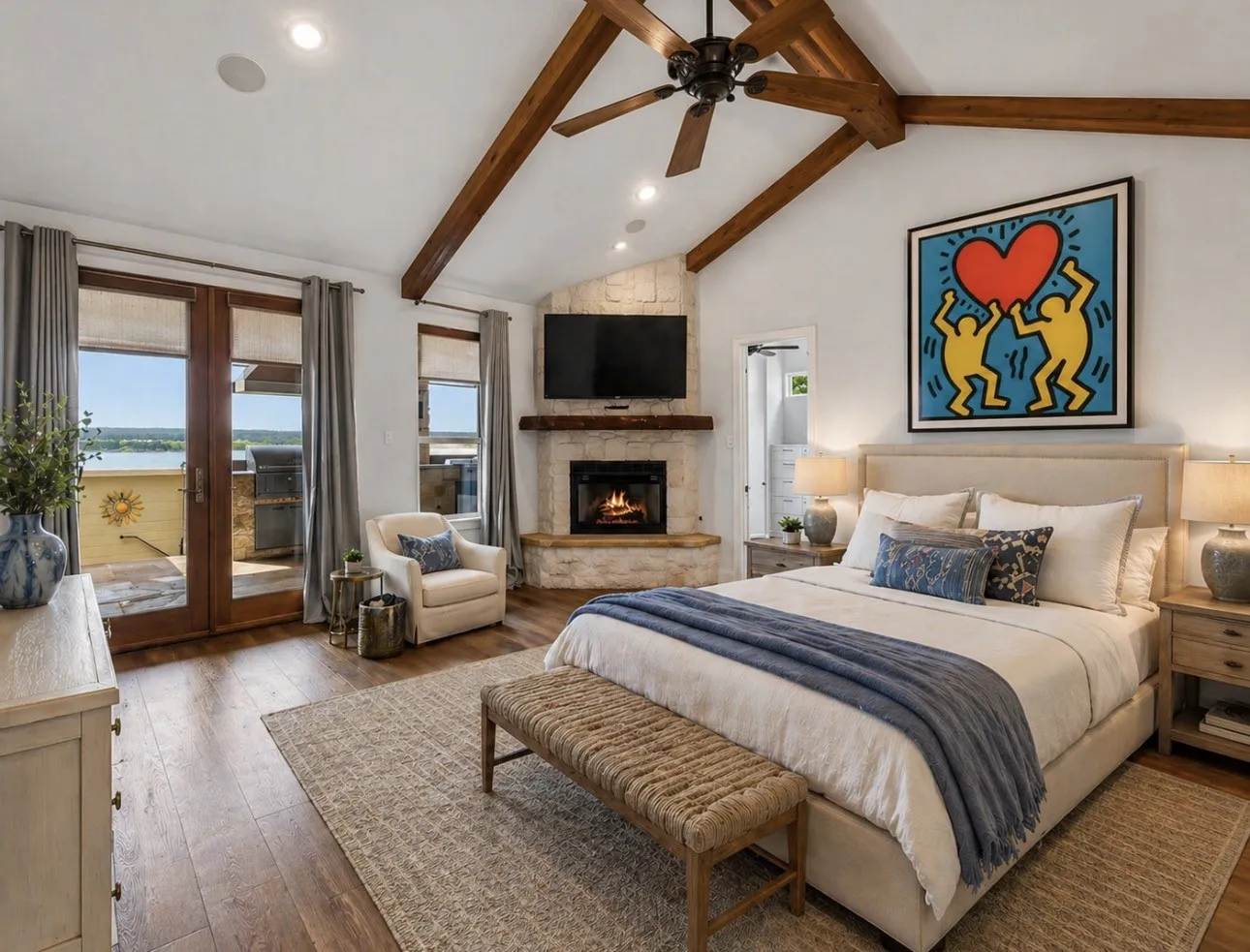 Vaulted beamed ceilings, stone floor-to-ceiling fireplace, french doors open to upper tier terrace area and the outdoor Fireplace and hearth.