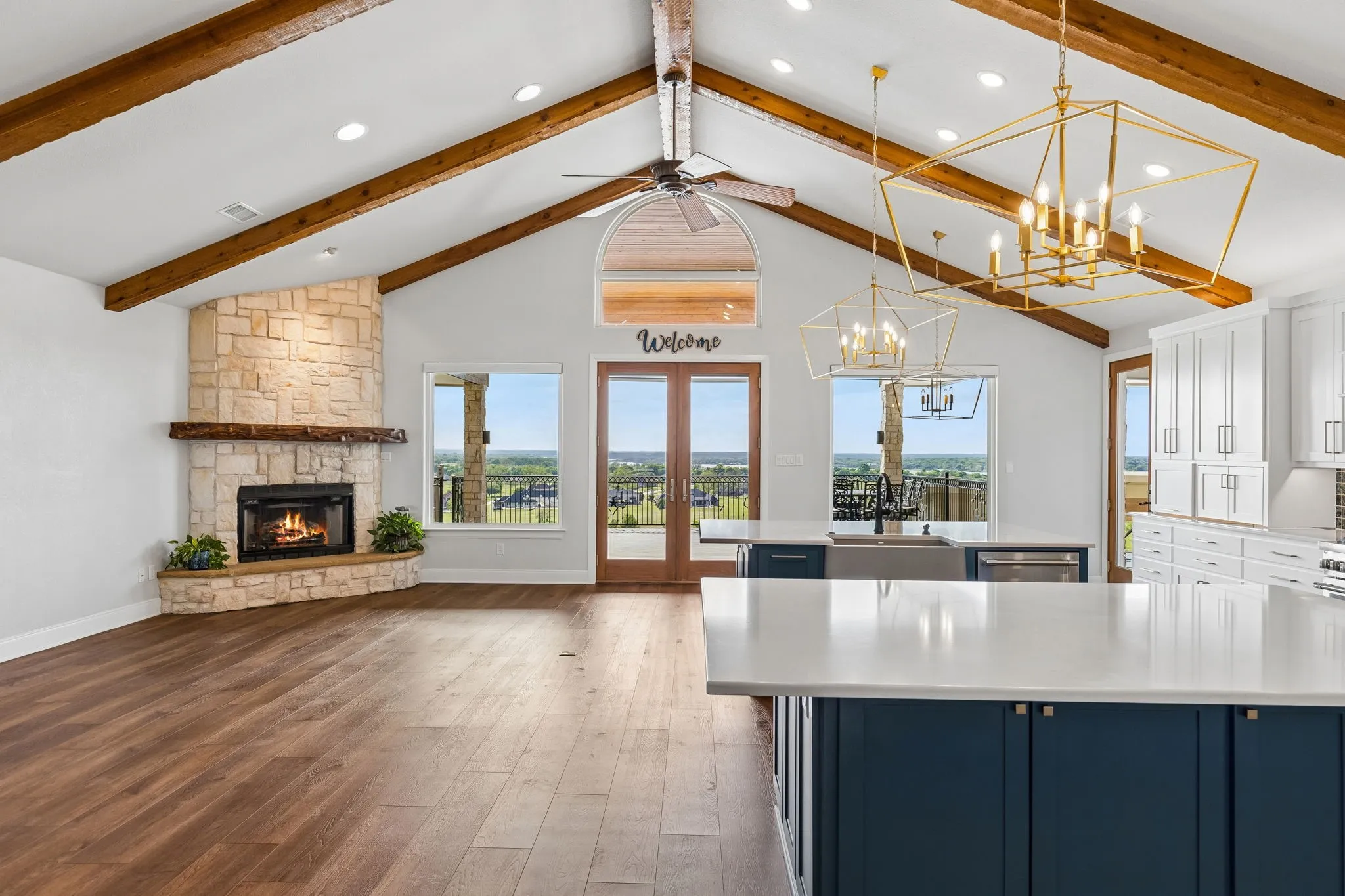 True large open concept space with beamed ceilings peaking approx 14' ft