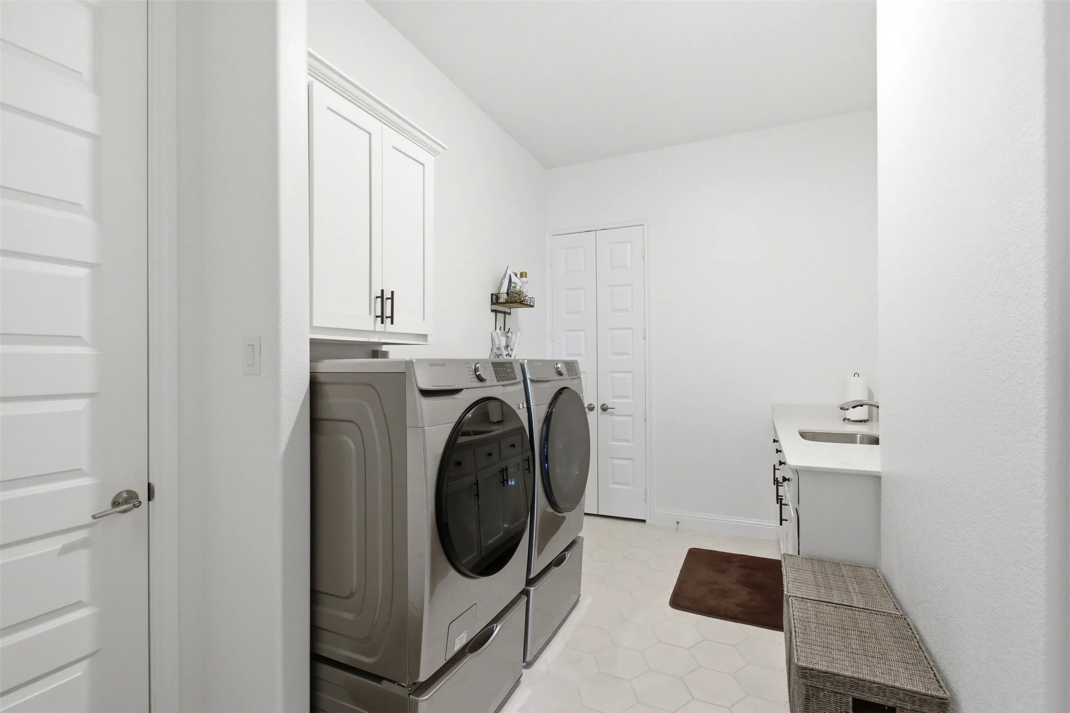 Utility room with storage and sink