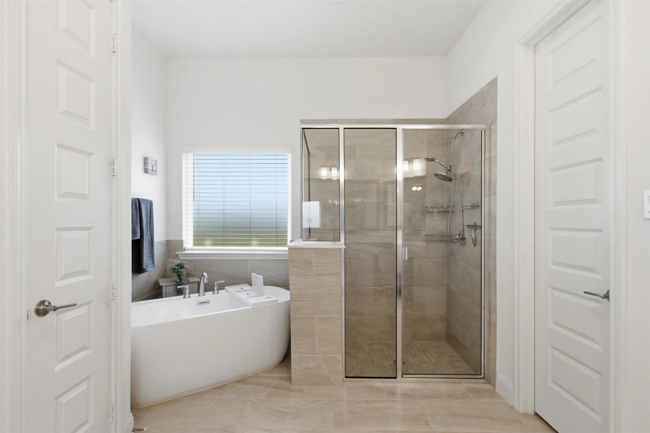 Freestanding soaking tub and separate shower