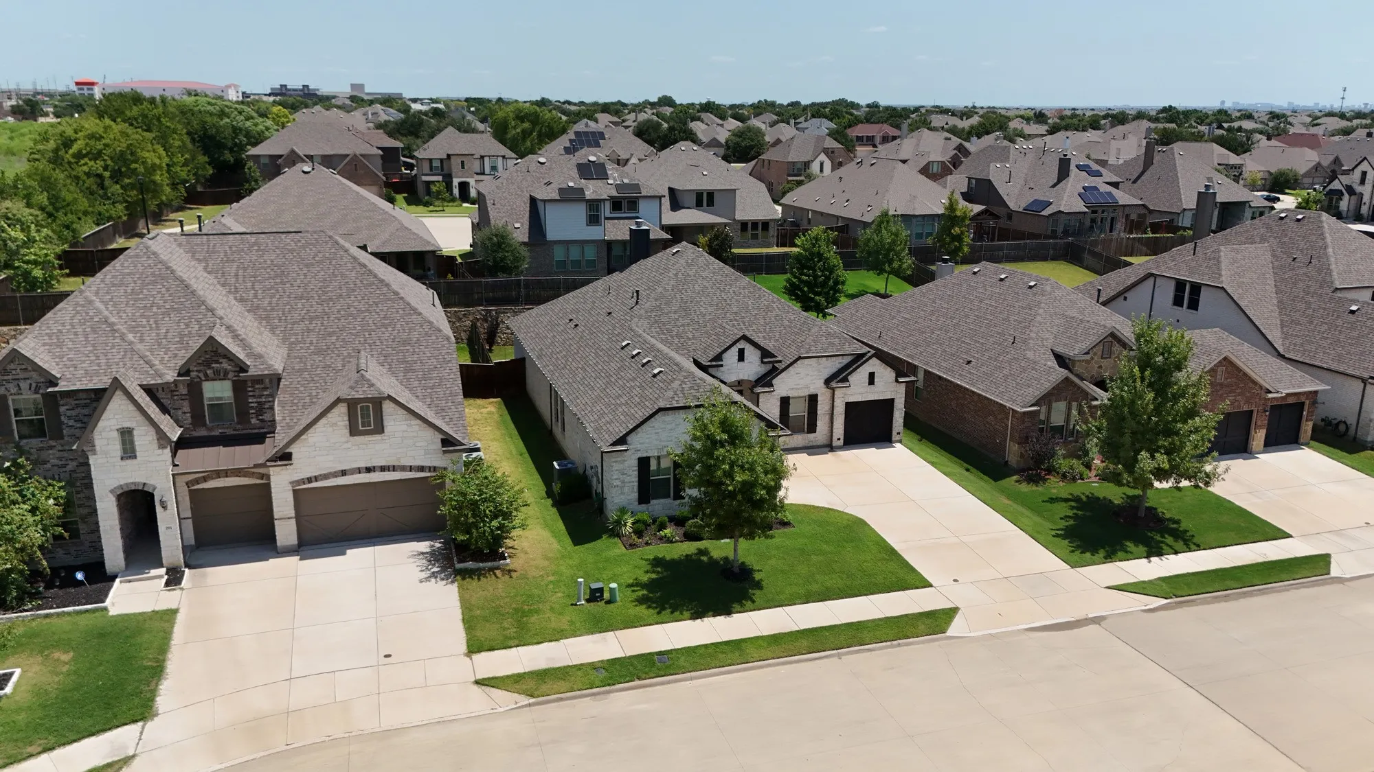 The property features an attached two-car garage and a paved driveway