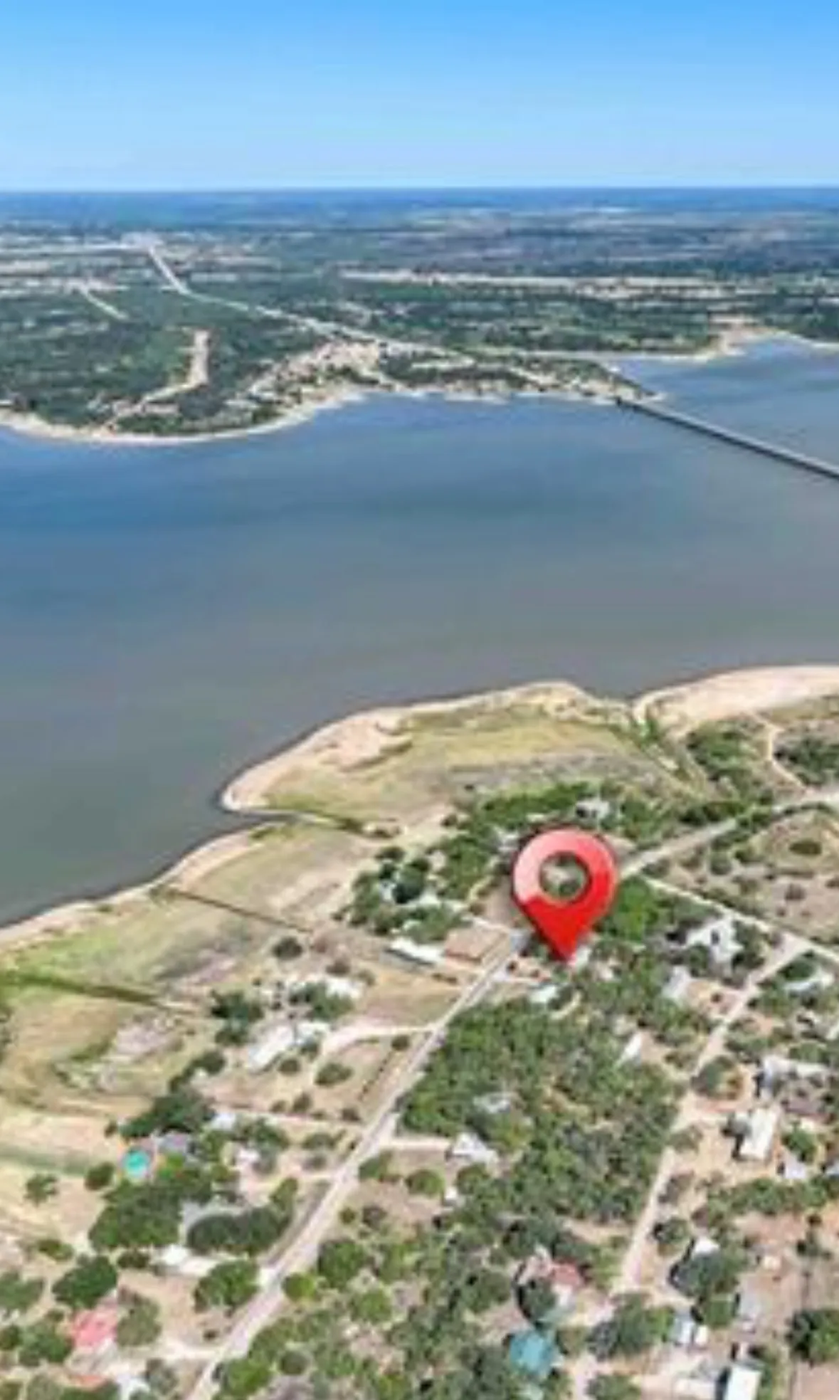 View of property location with a large body of water