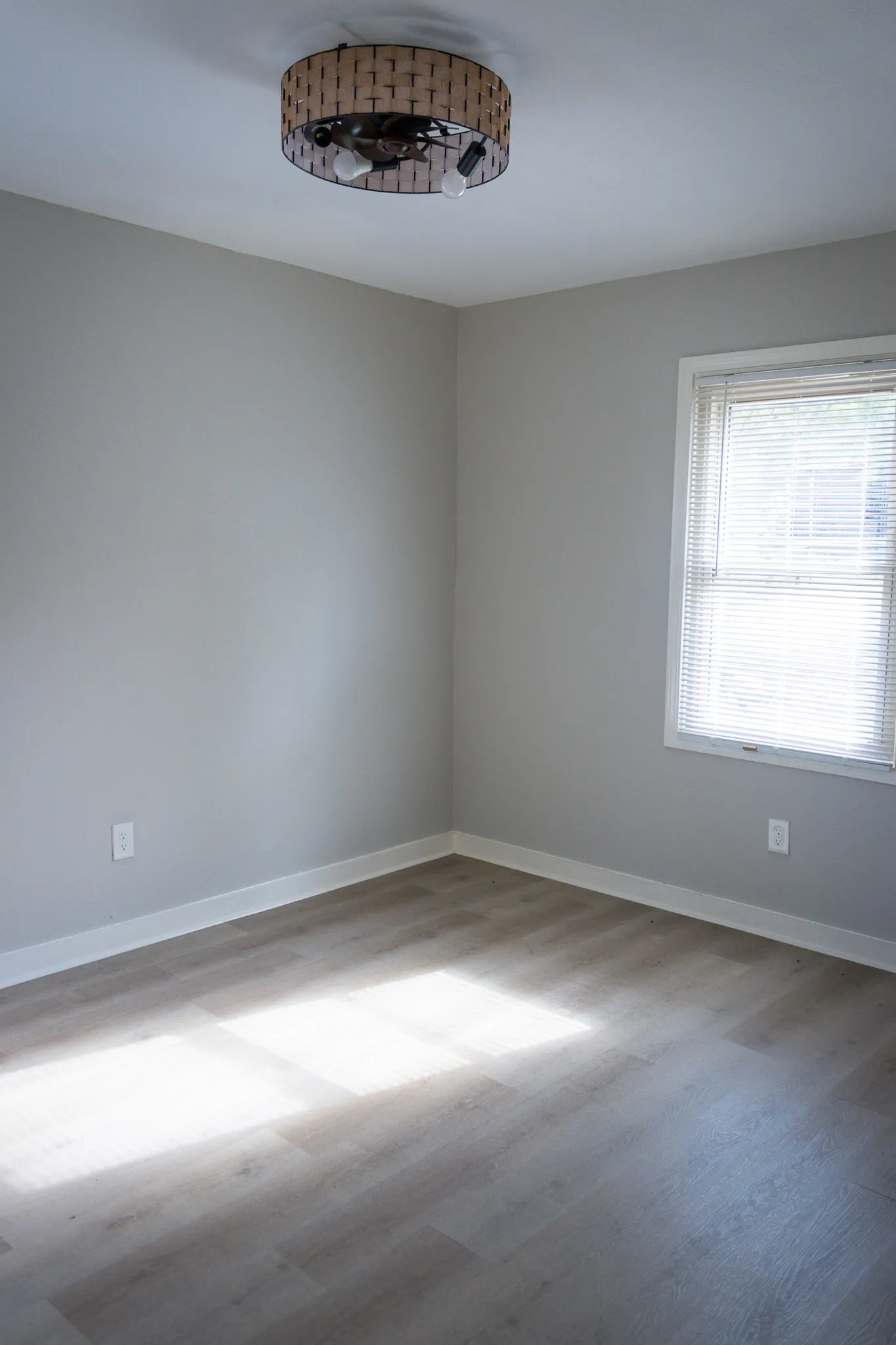 Unfurnished room featuring wood finished floors and baseboards