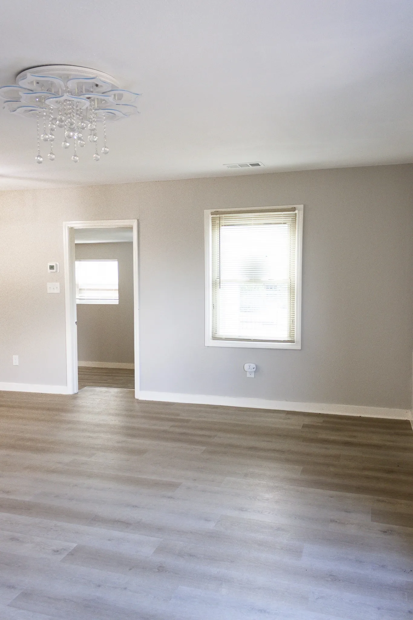 Empty room featuring baseboards and wood finished floors