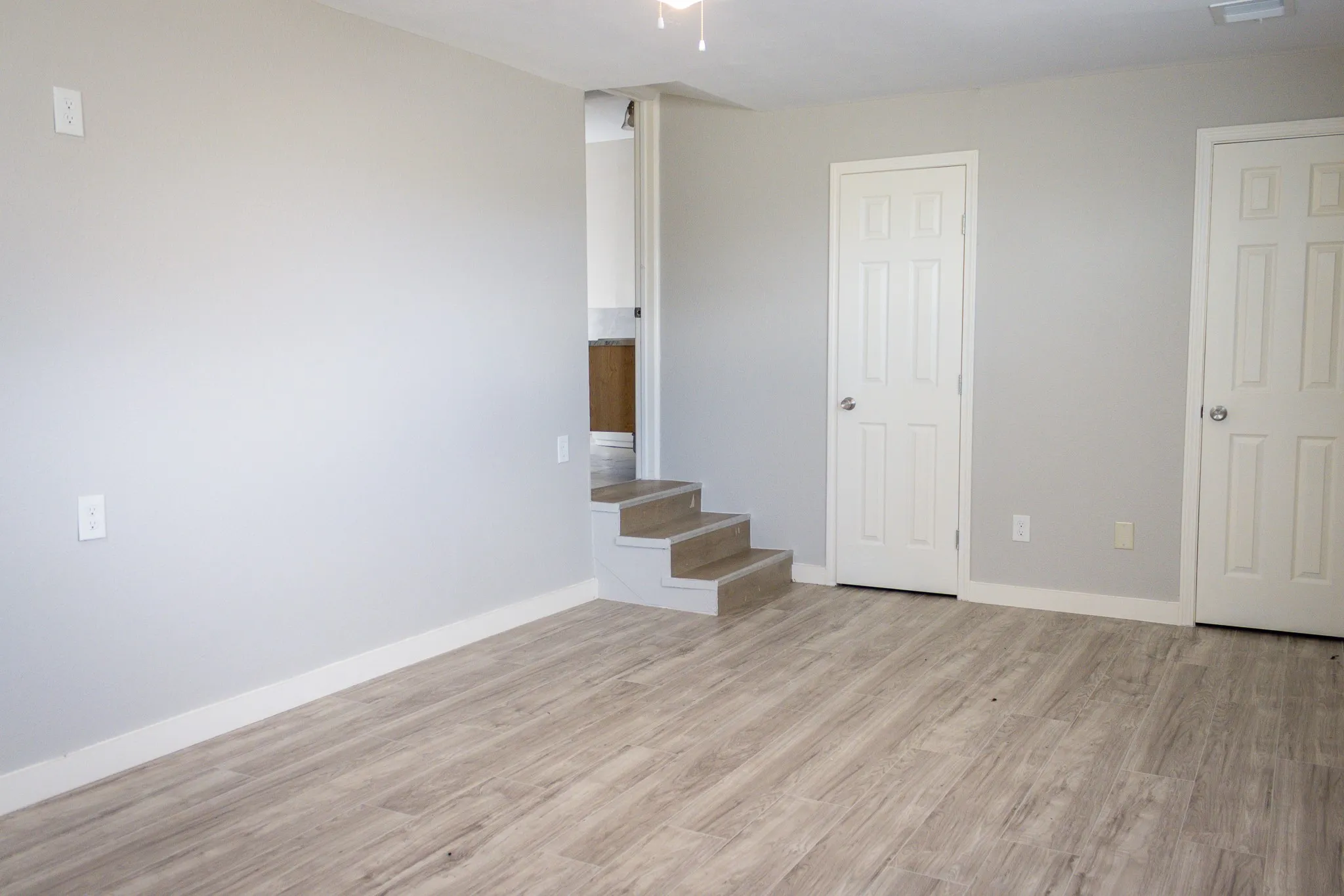 Unfurnished bedroom with light wood-type flooring