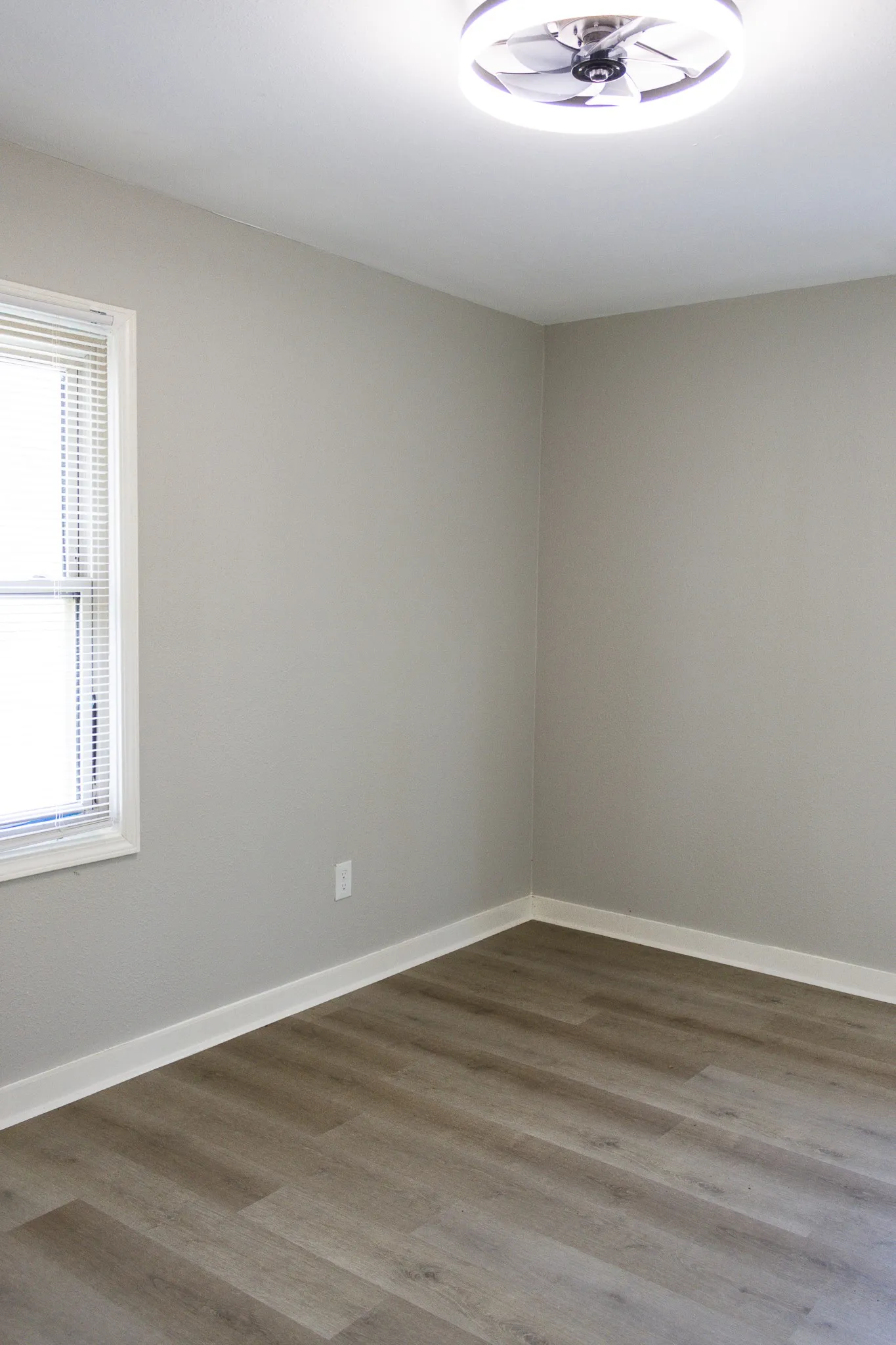 Empty room featuring wood finished floors and baseboards