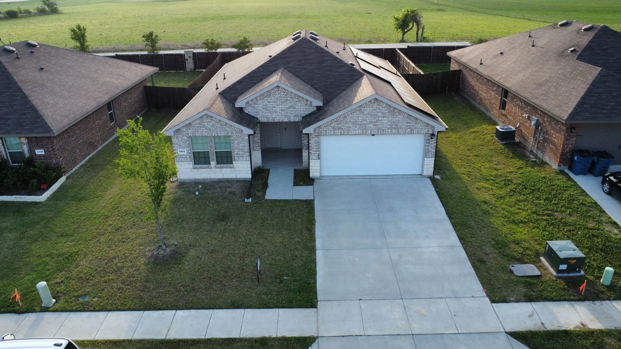 Single-story residence featuring a two-car garage and a concrete driveway