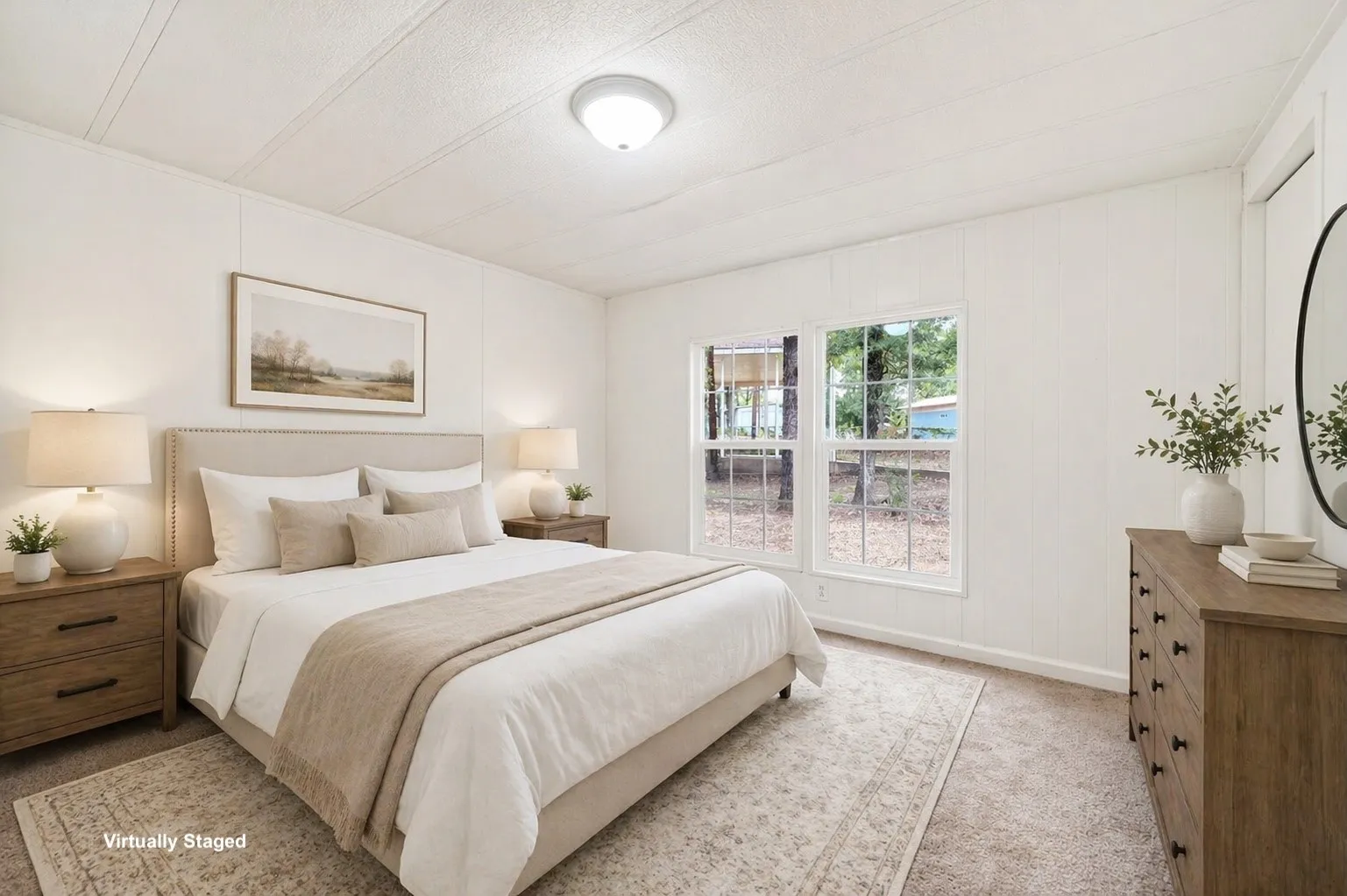 Carpeted room featuring a neutral color palette, two paneled windows, and a ceiling-mounted light fixture