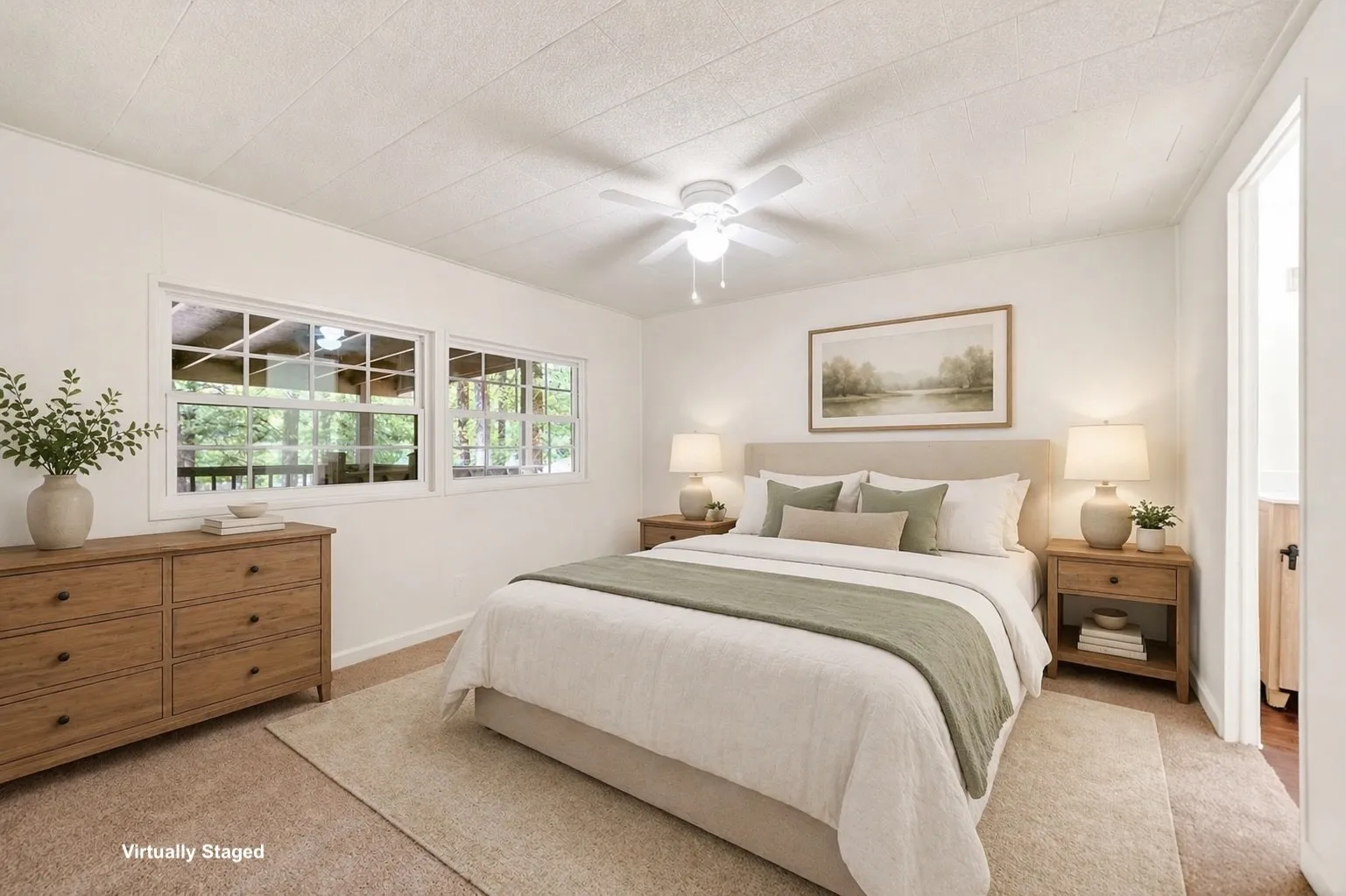 Bedroom featuring two large windows, a ceiling fan, and carpet flooring