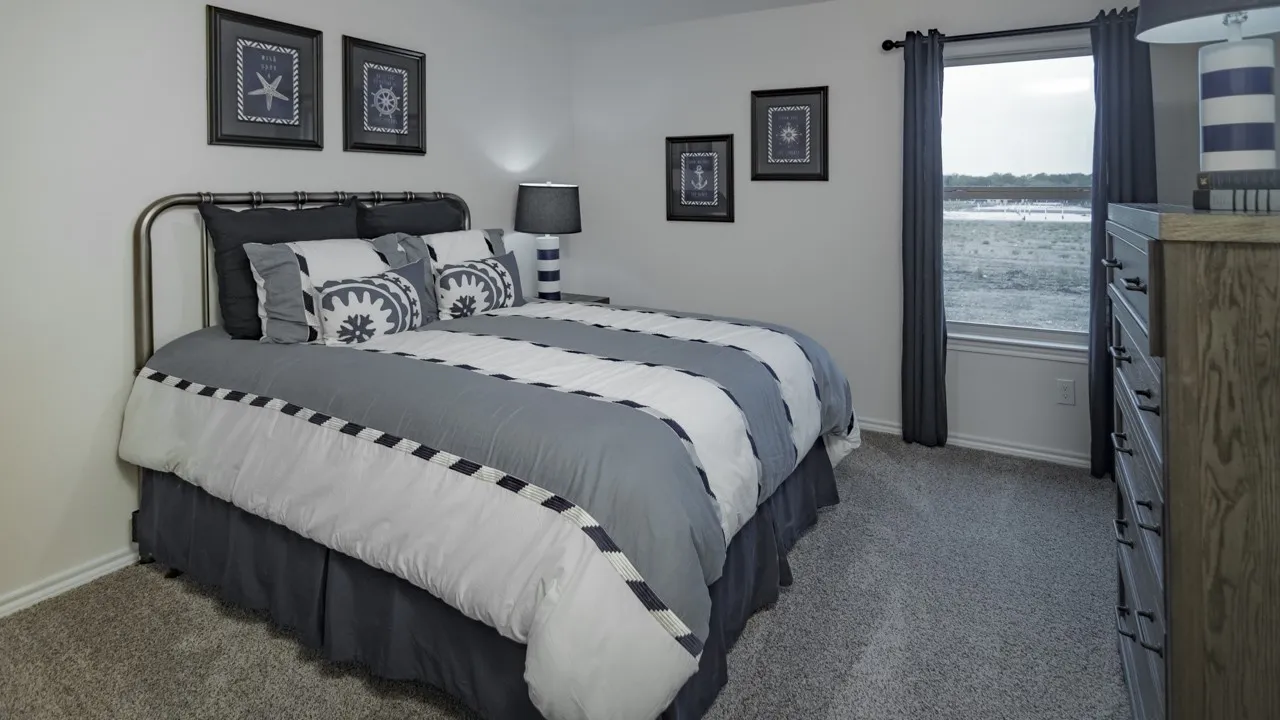 Plush gray carpeting extends throughout this room, featuring light gray walls
