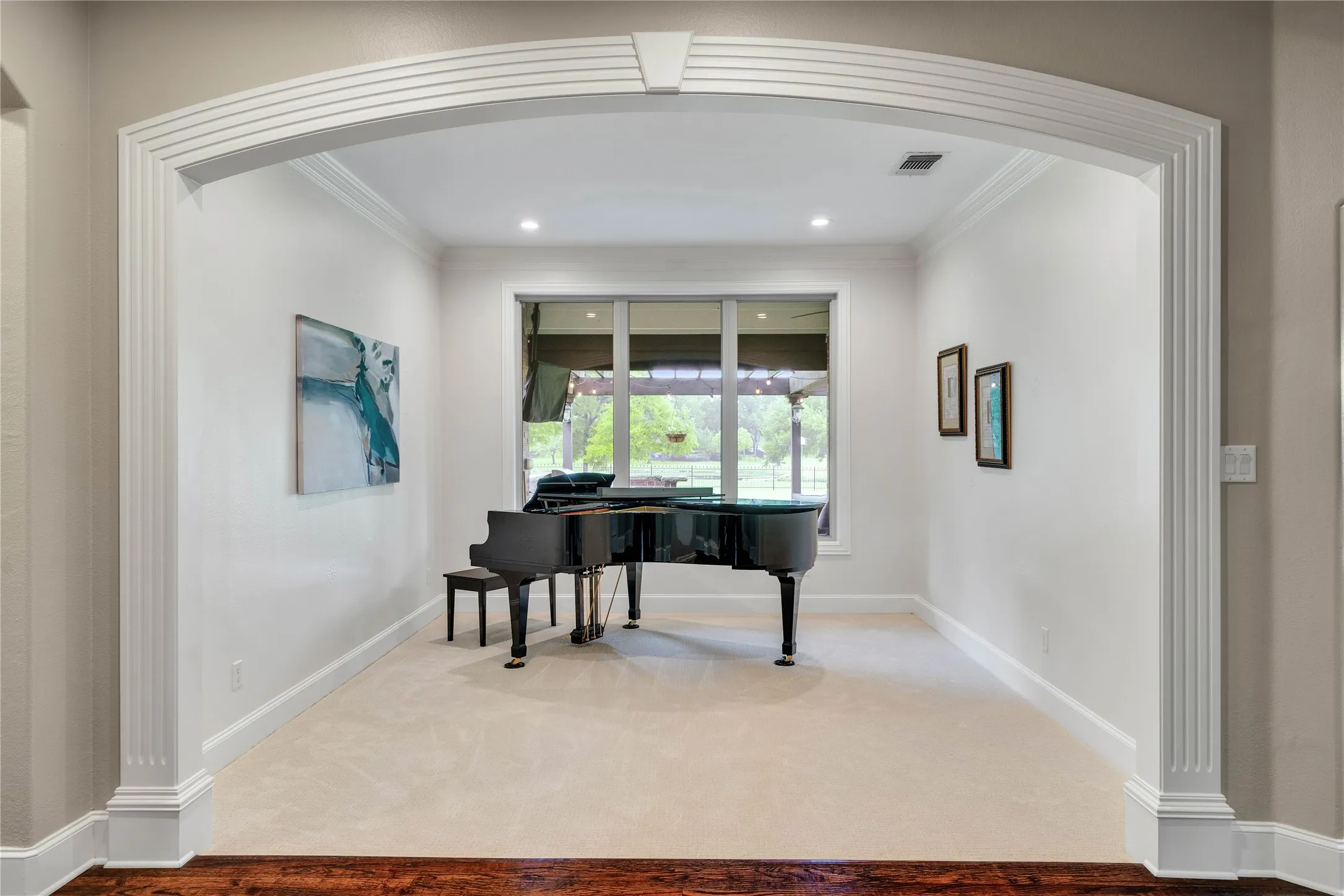 Look at the gorgeous Formal Living Room with arched entry, and perfect views of nature.