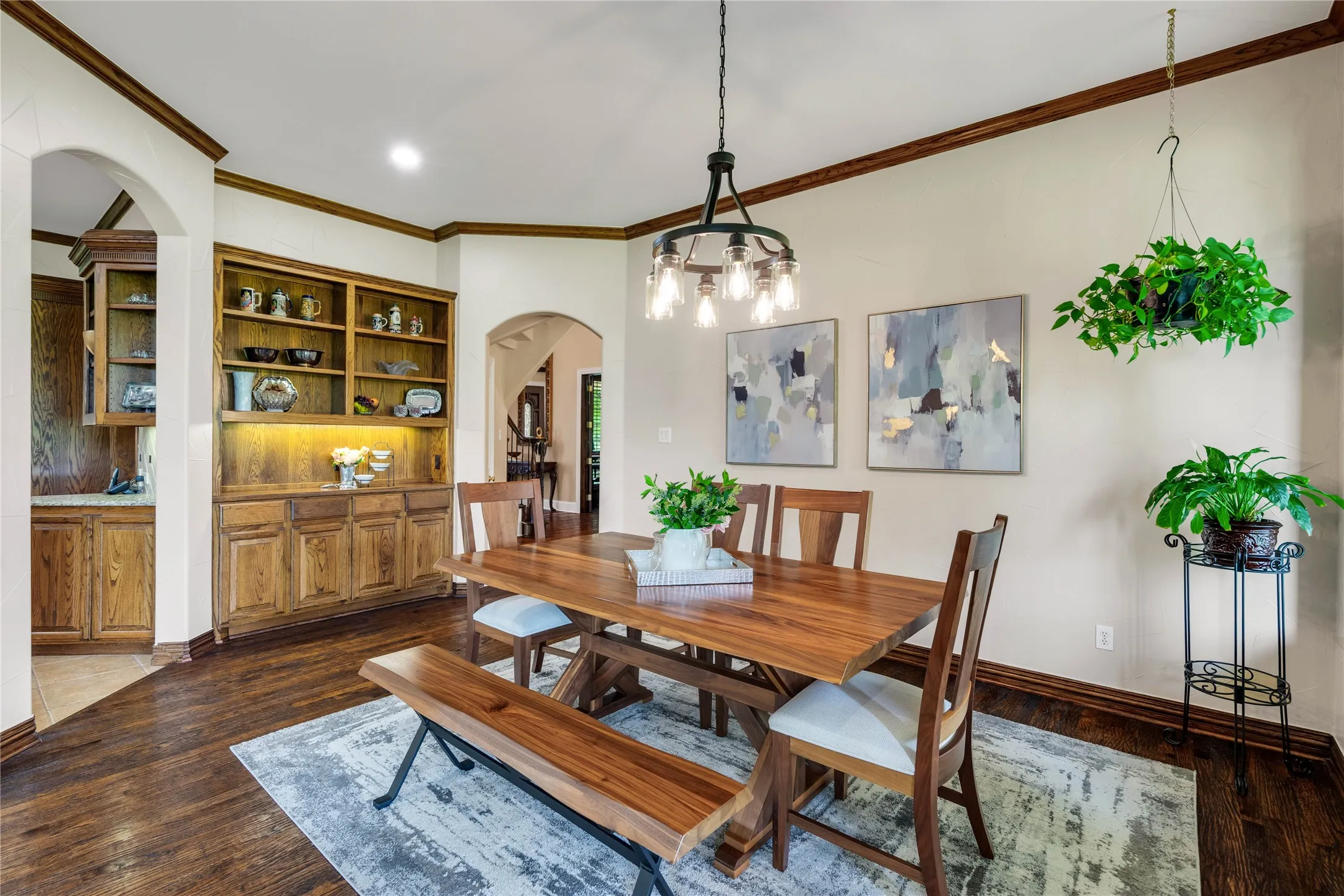 Beautiful built-in cabinetry in the breakfast area with new chandelier.