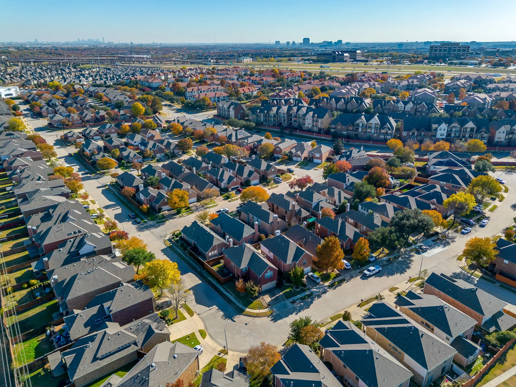 Aerial overview of property's location with nearby suburban area
