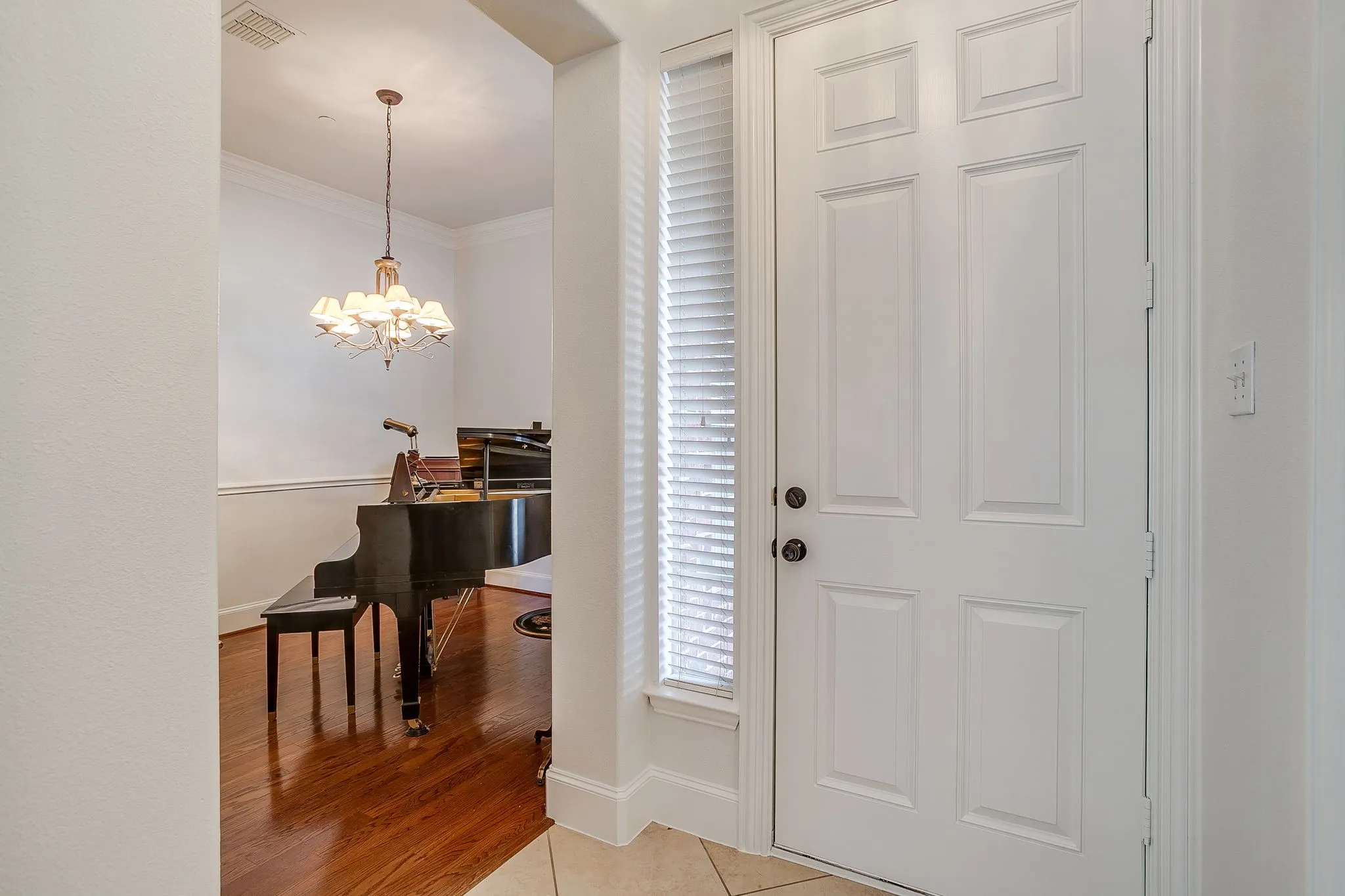 Bedroom with lofted ceiling, light colored carpet, and ceiling fan