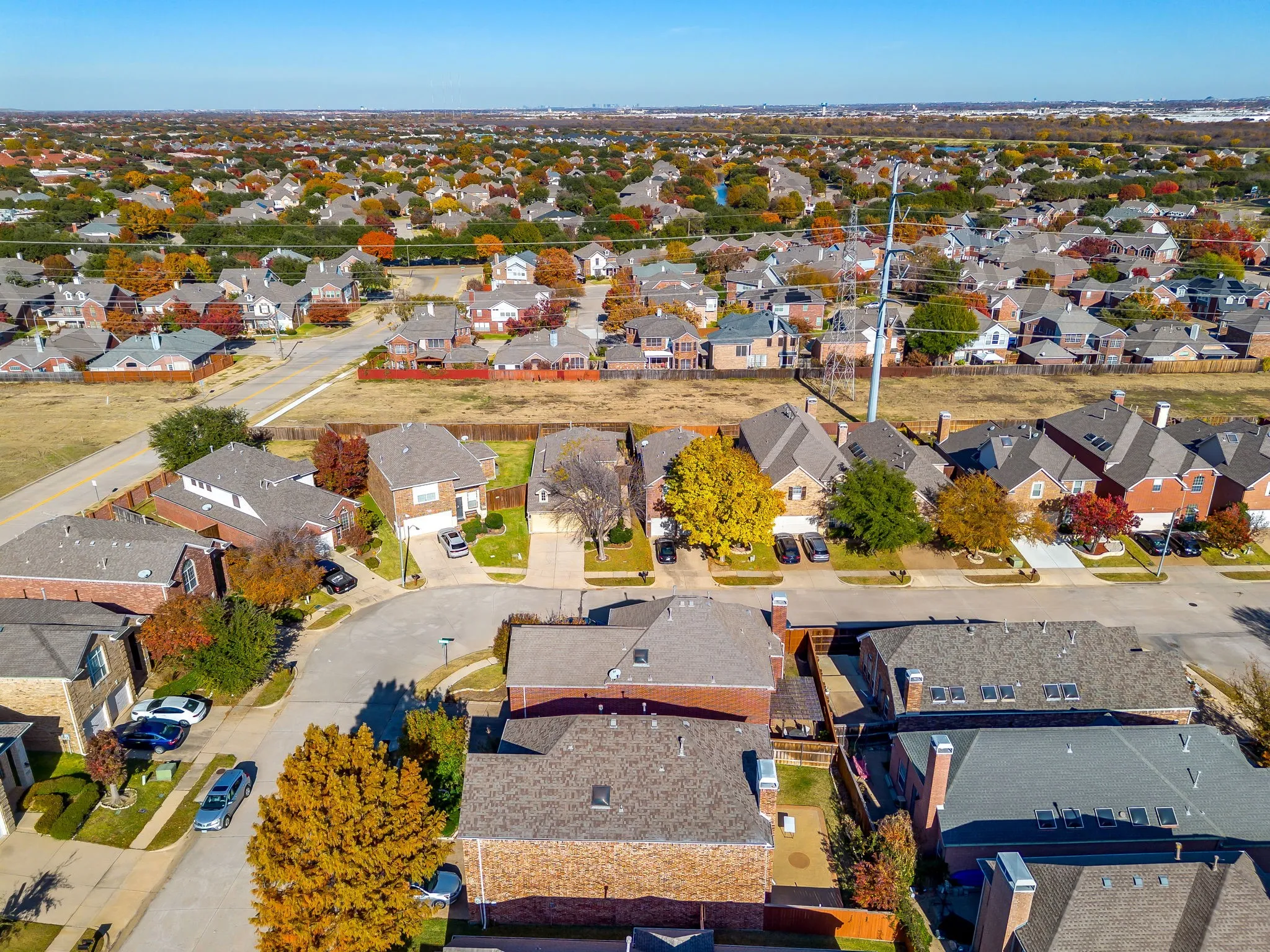 Aerial overview of property's location featuring nearby suburban area