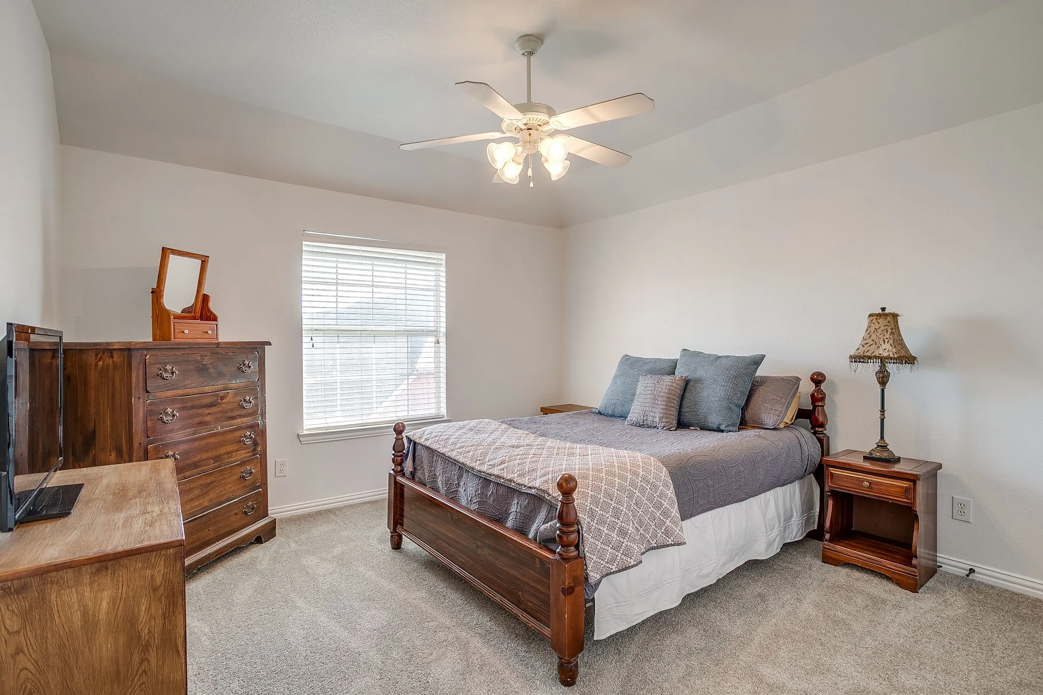 Bedroom featuring ceiling fan and light colored carpet