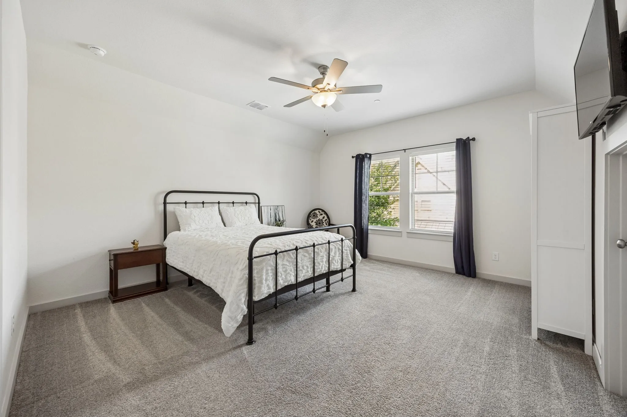 1 of 2 generous bedrooms up with walk in closet.