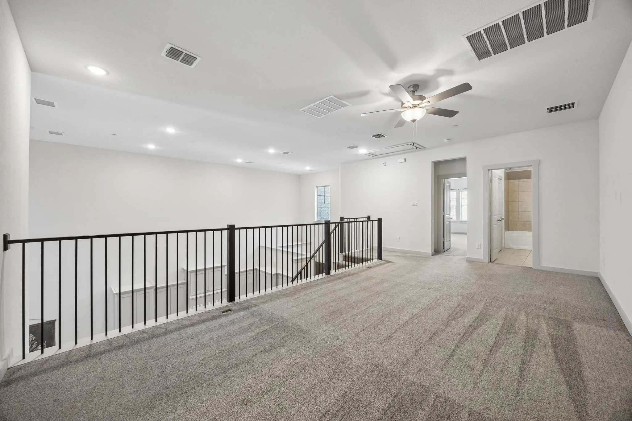 Separate and away from the first floor, this 2nd living space is shared by 2 bedrooms.