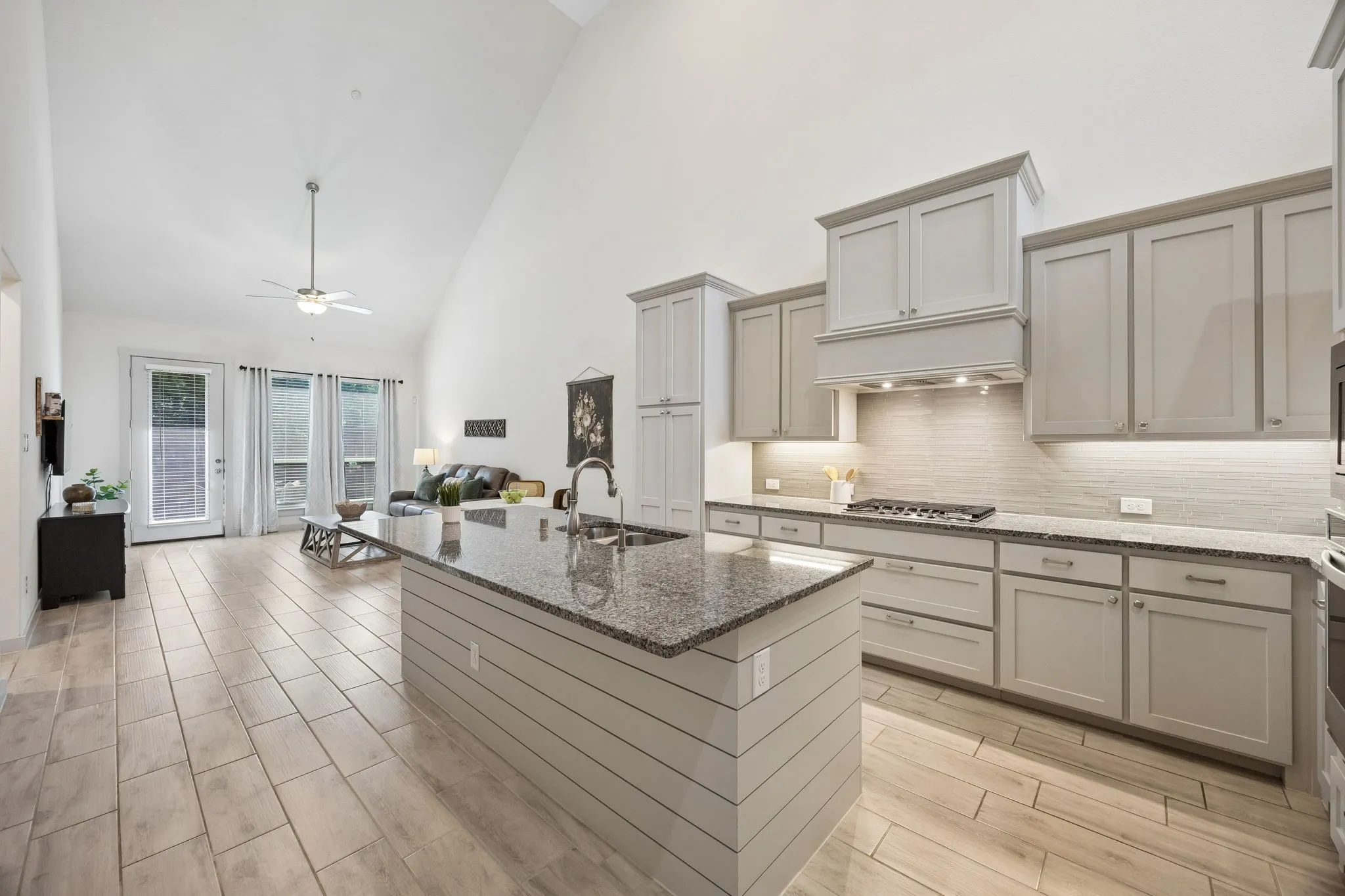Kitchen flows seamlessly to the living room and back patio.
