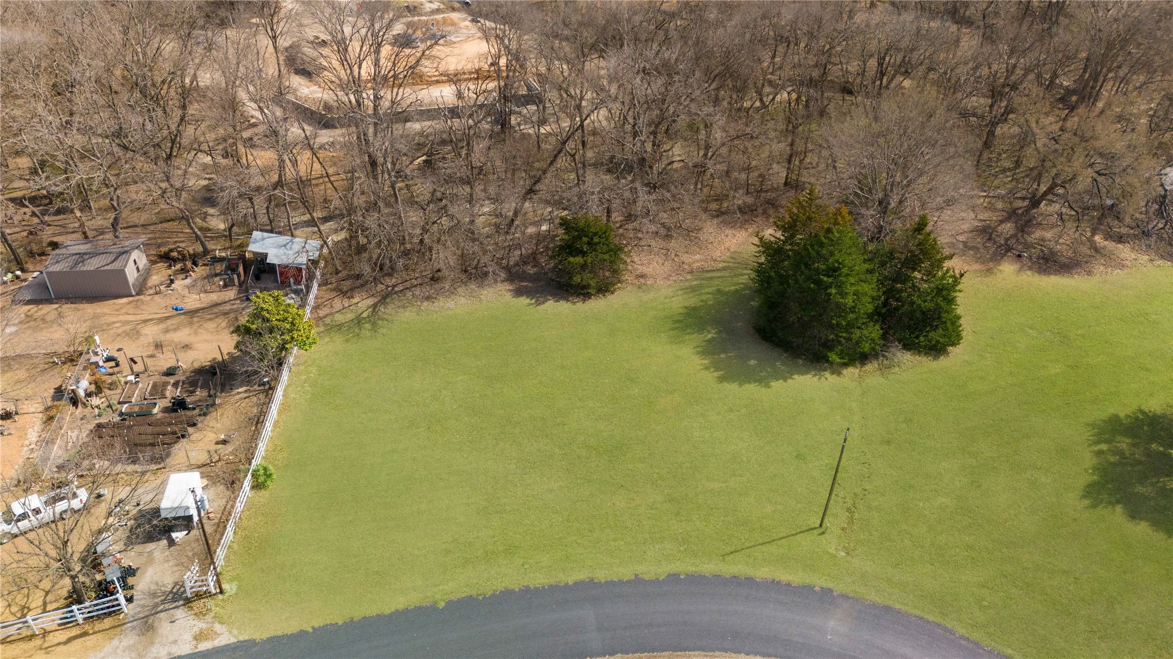 Expansive lot featuring a manicured green lawn
