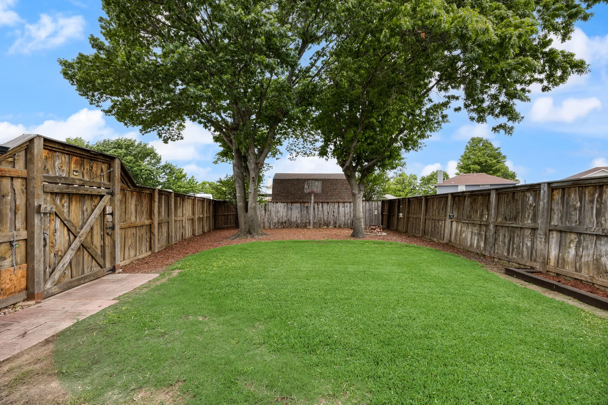Large backyard with plenty of room for a pool, dogs, playset, etc.
