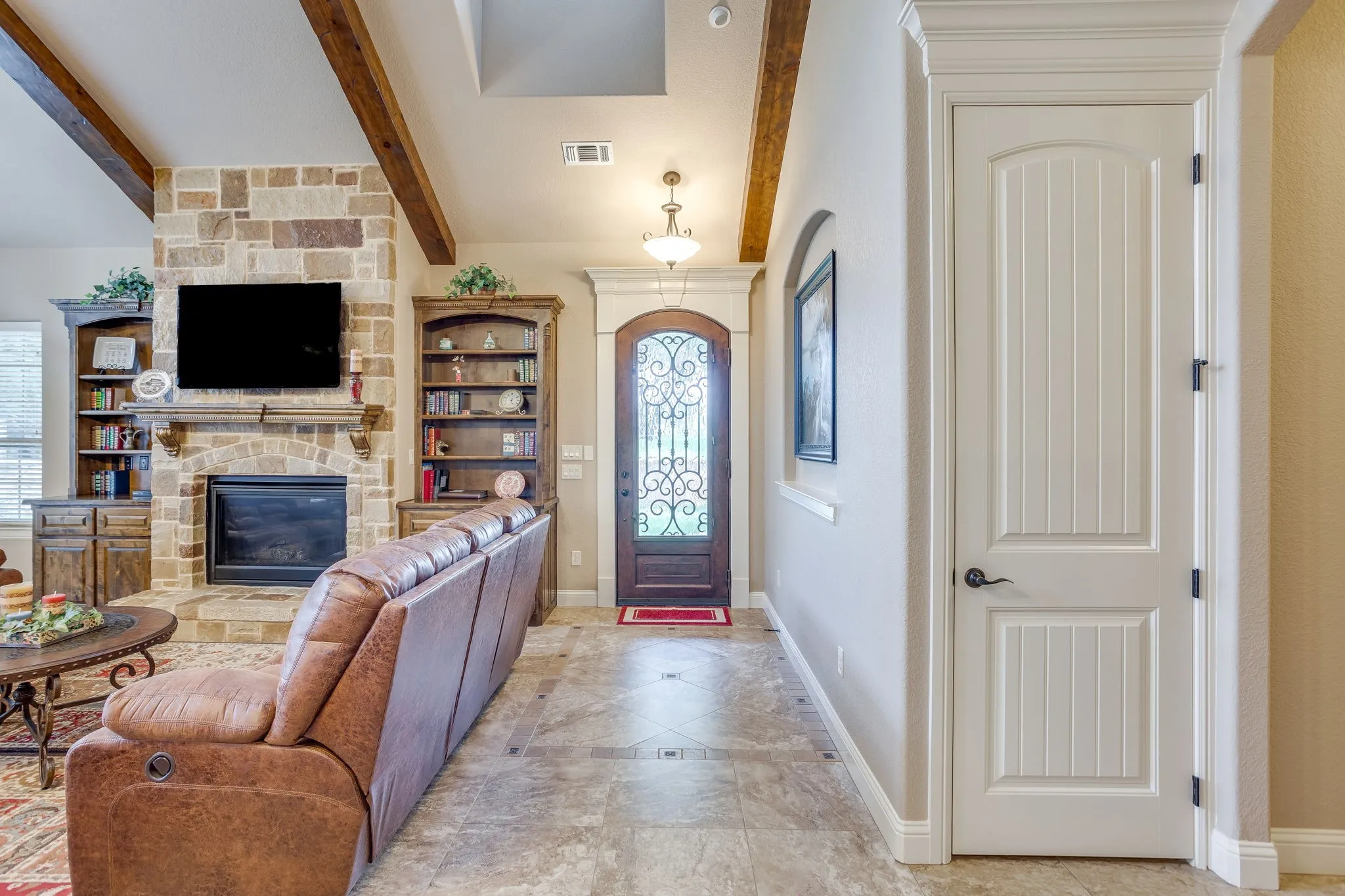 Foyer entry featuring a decorative glass-paned wood door