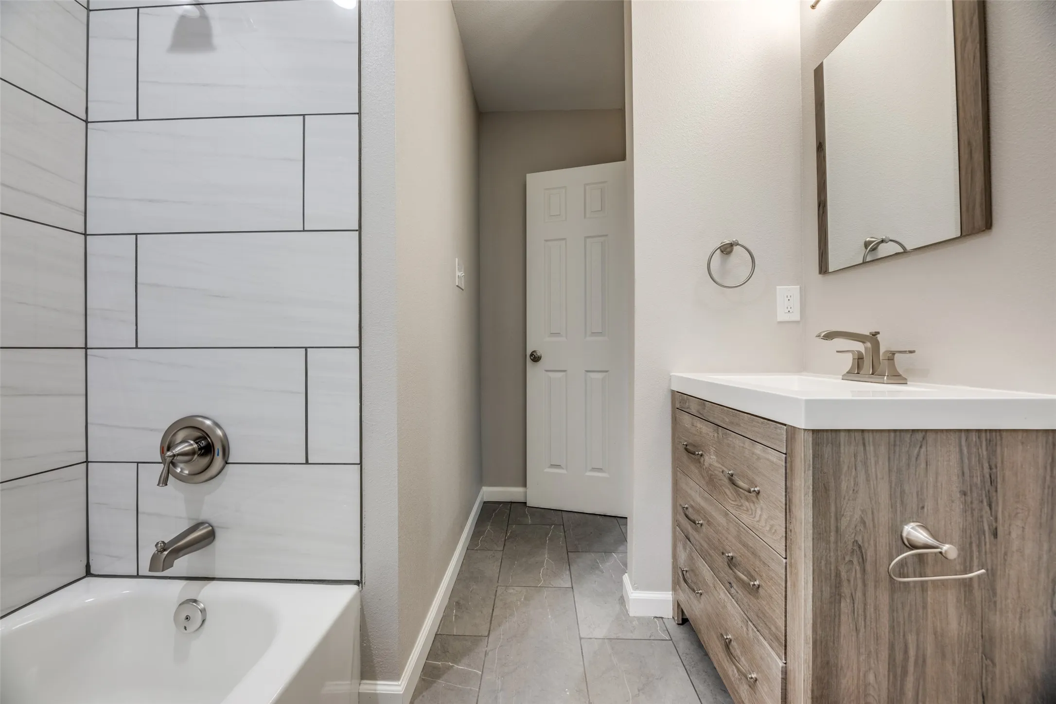 Full bathroom with vanity and tub / shower combination