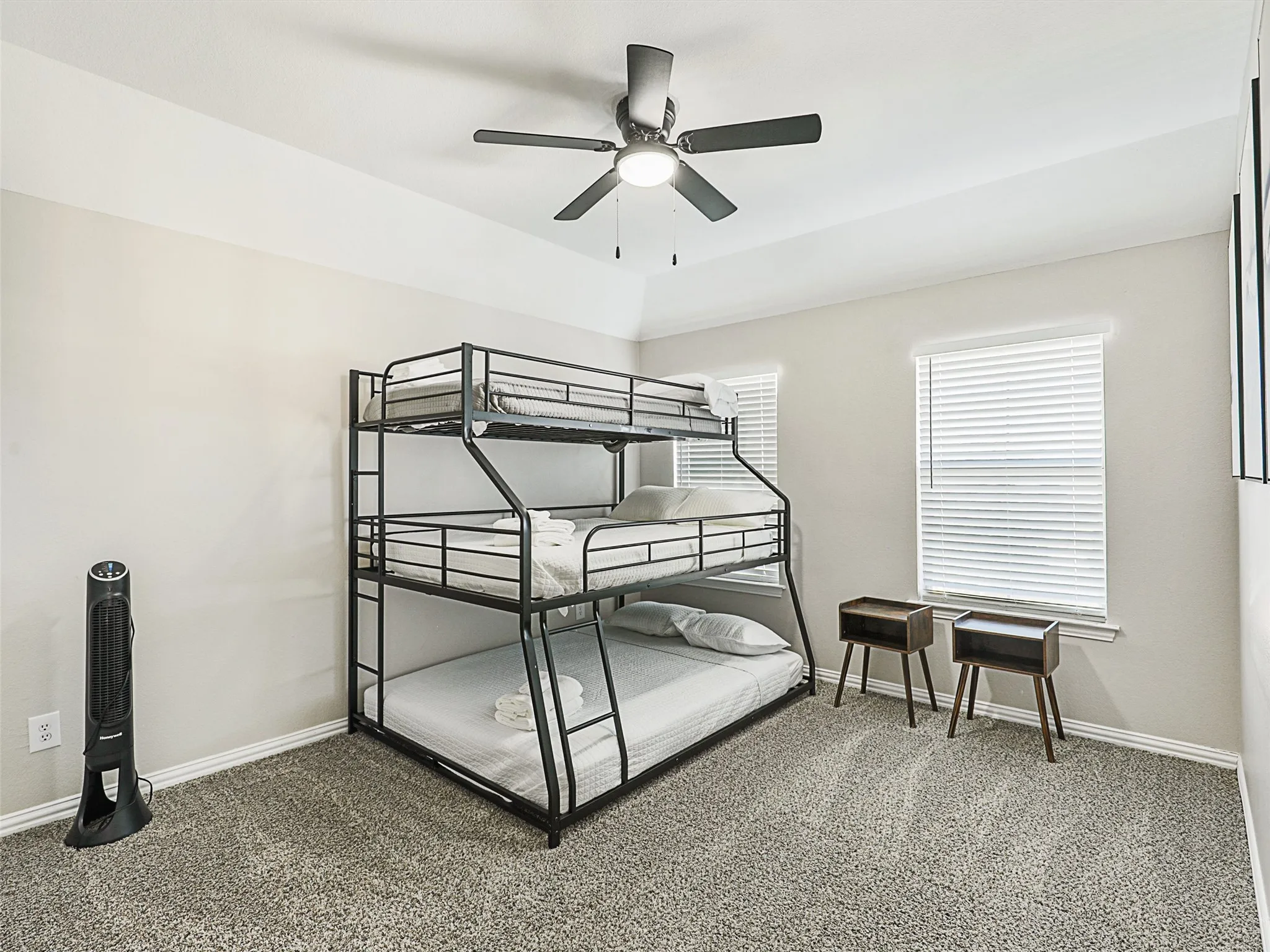 Bedroom featuring light gray carpeting and neutral wall paint