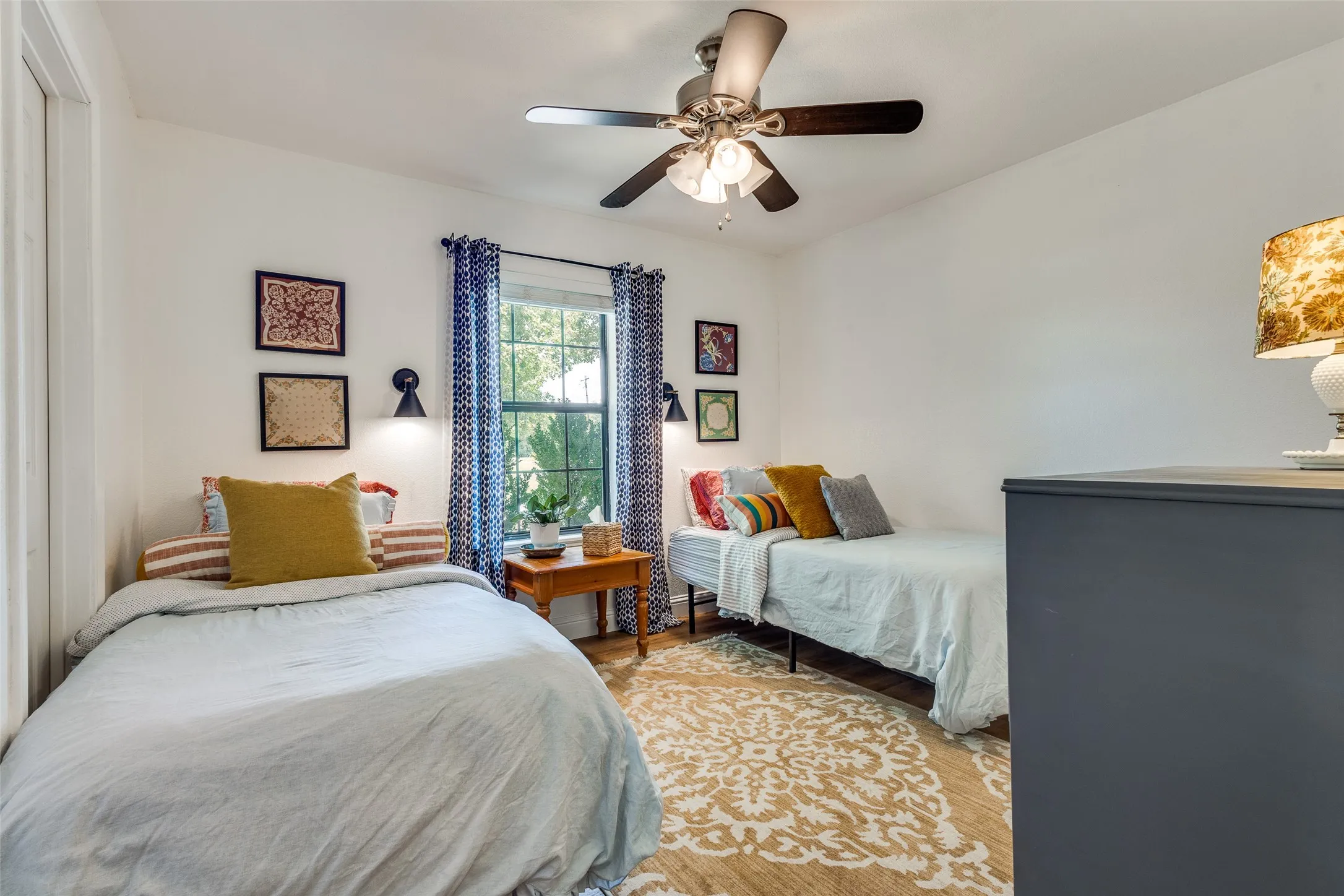 Another secondary bedroom with views of the pond and walk in closet