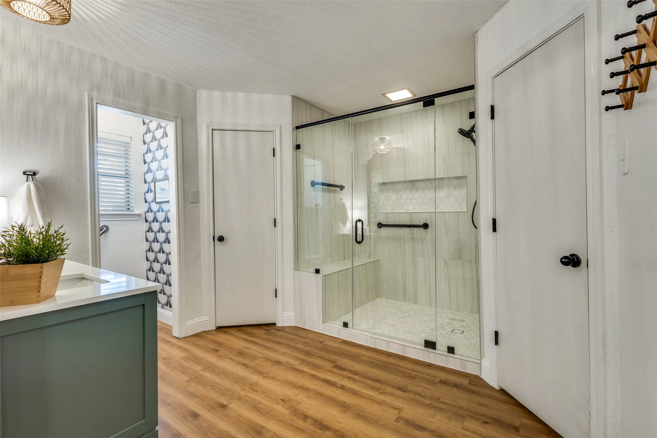 Remodeled master bathroom has oversized walk in shower, separate water closet, and 3 walk in closets