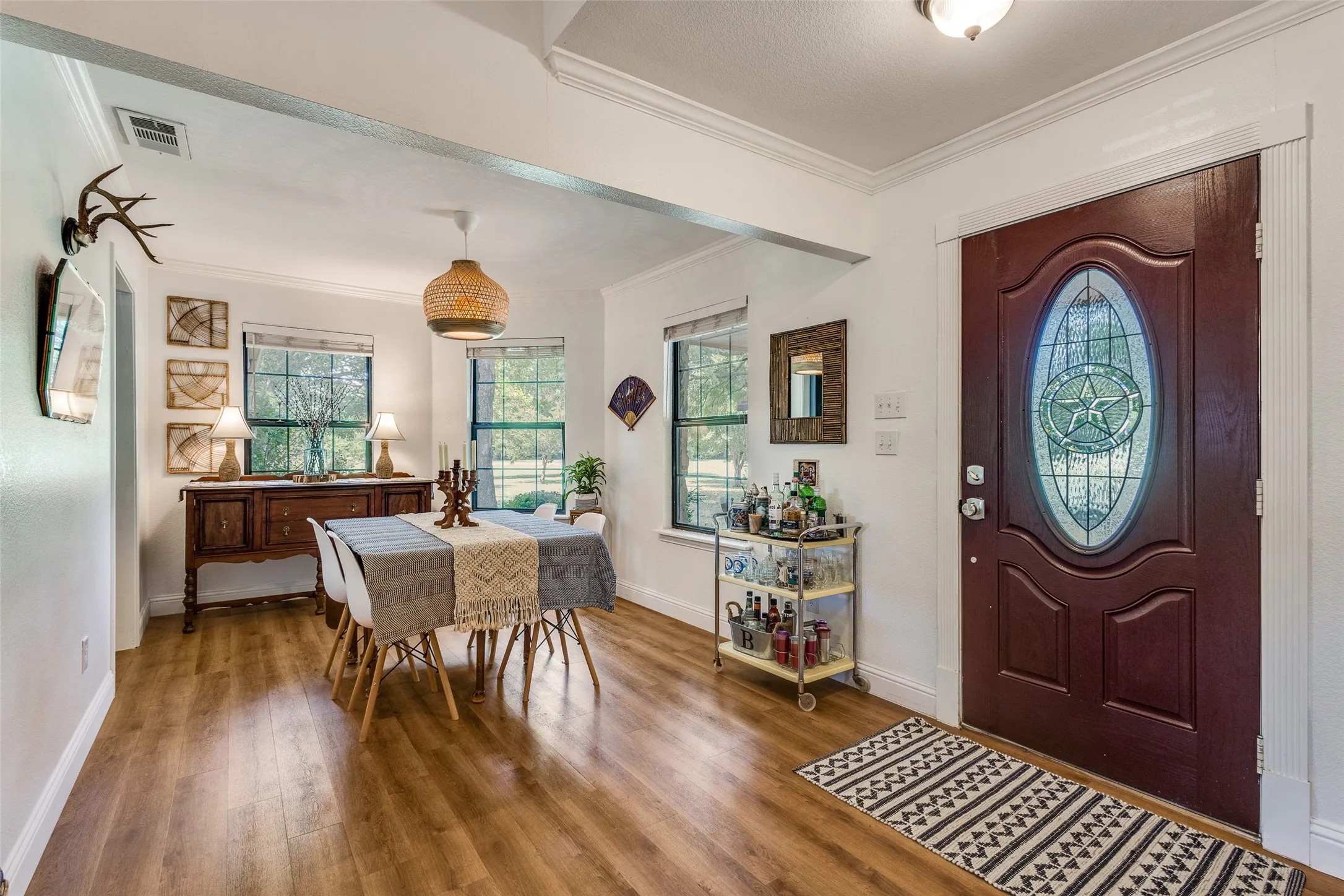 Dining room with lots of natural light and views of the pond