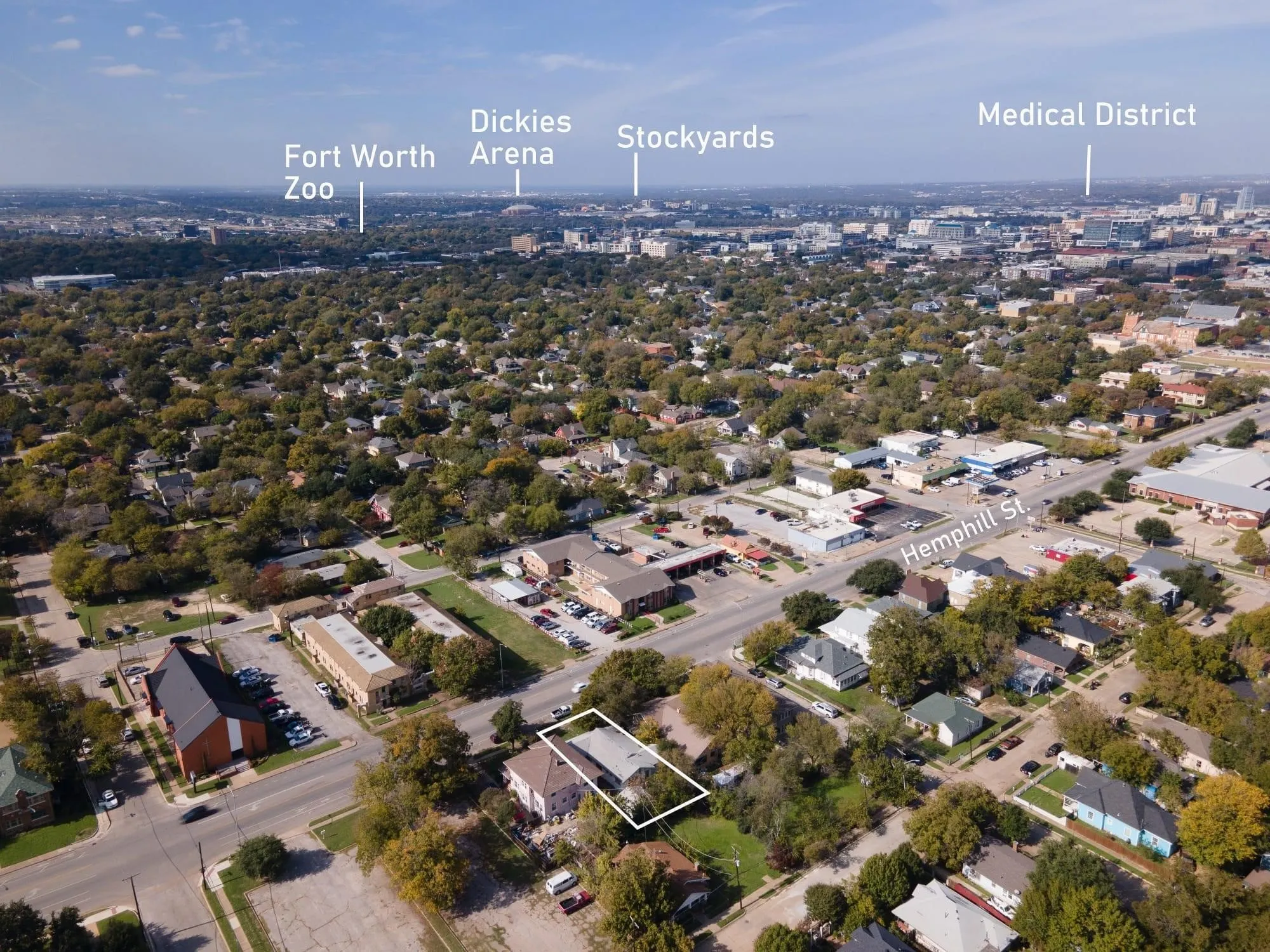 Aerial perspective showcasing the property's proximity to Hemphill Street, surrounded by mature trees and residential structures