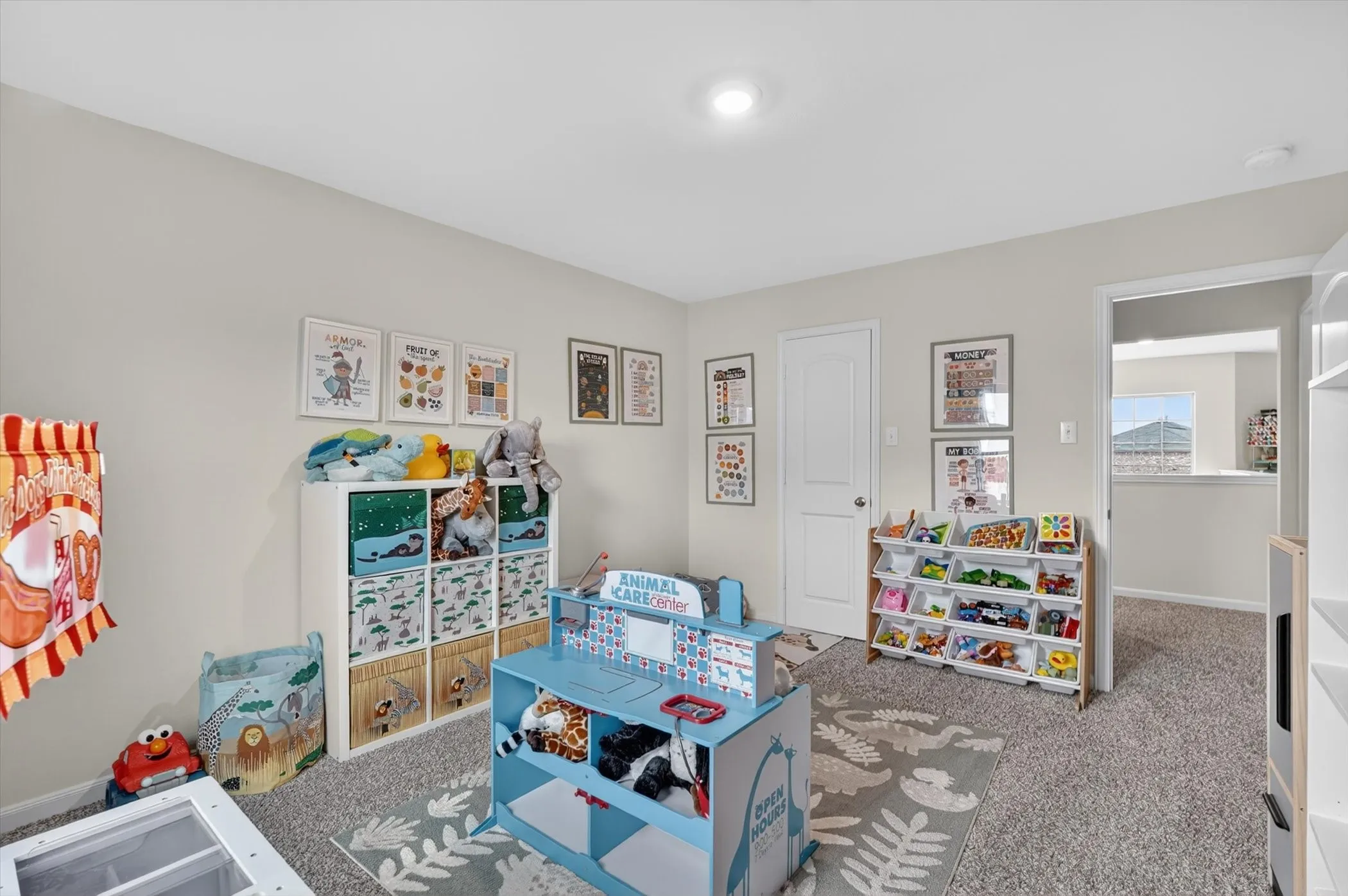Carpeted room with light neutral walls, recessed lighting, and white trim