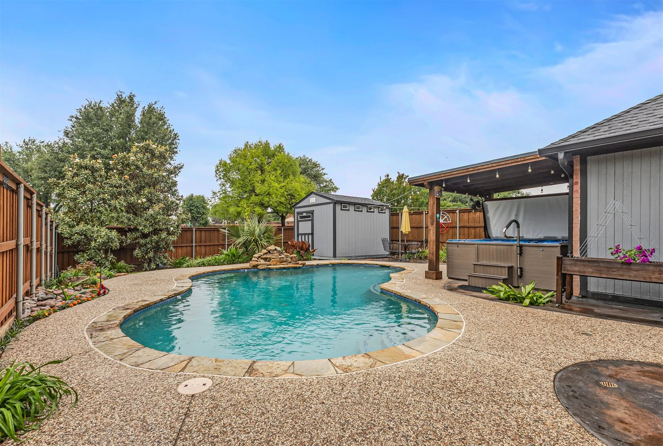 Resurfaced pool with newer pergola and hot tub