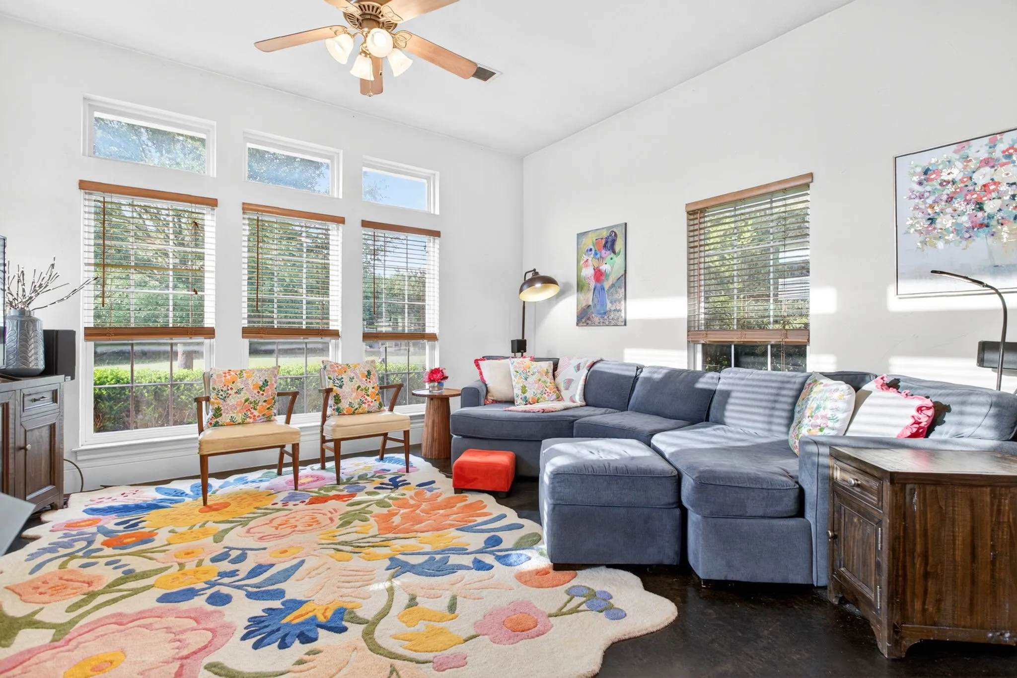 Living area is so inviting with more walls of windows.