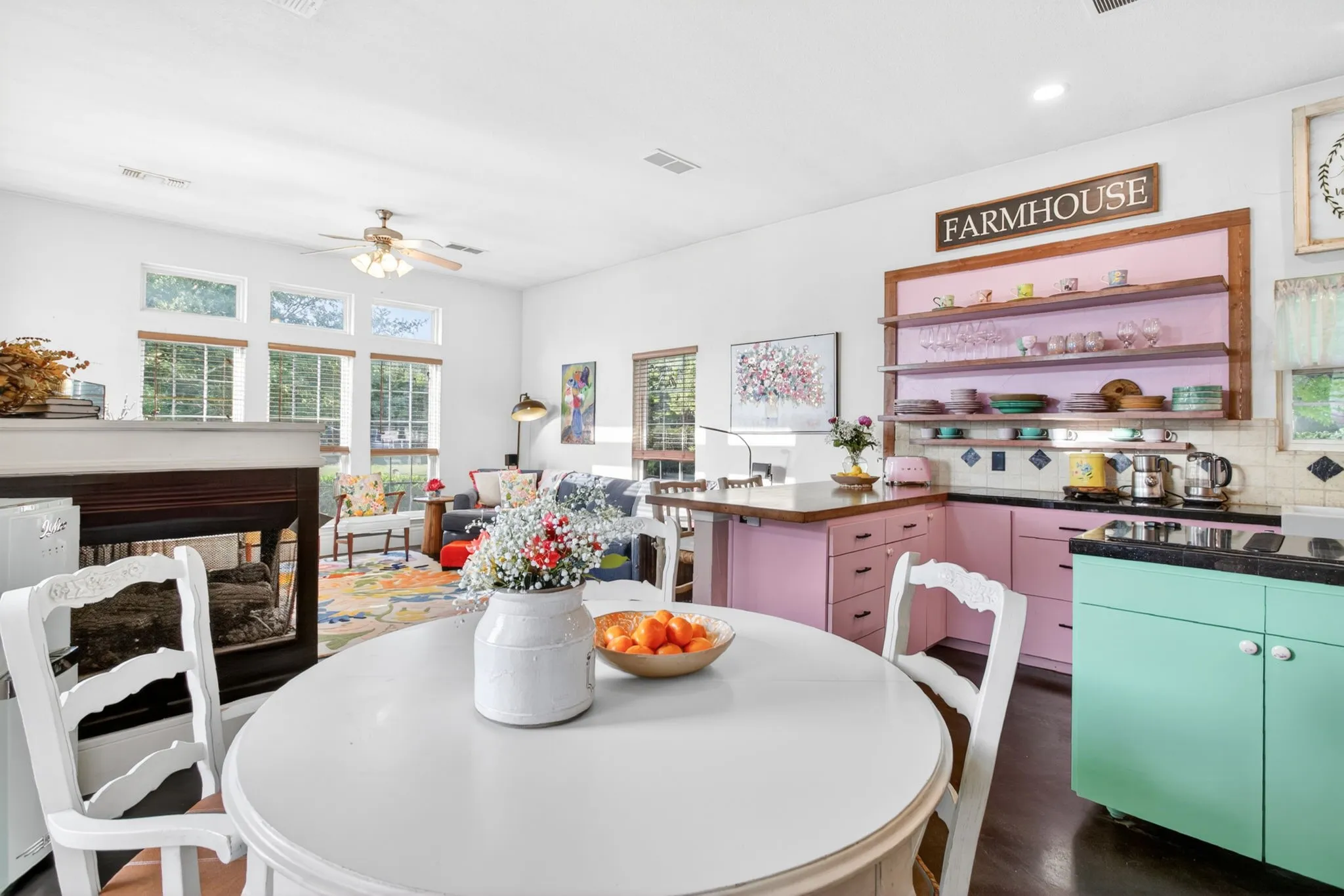 Butcher block breakfast bar anchors the space, lending warmth and a cozy space to land.