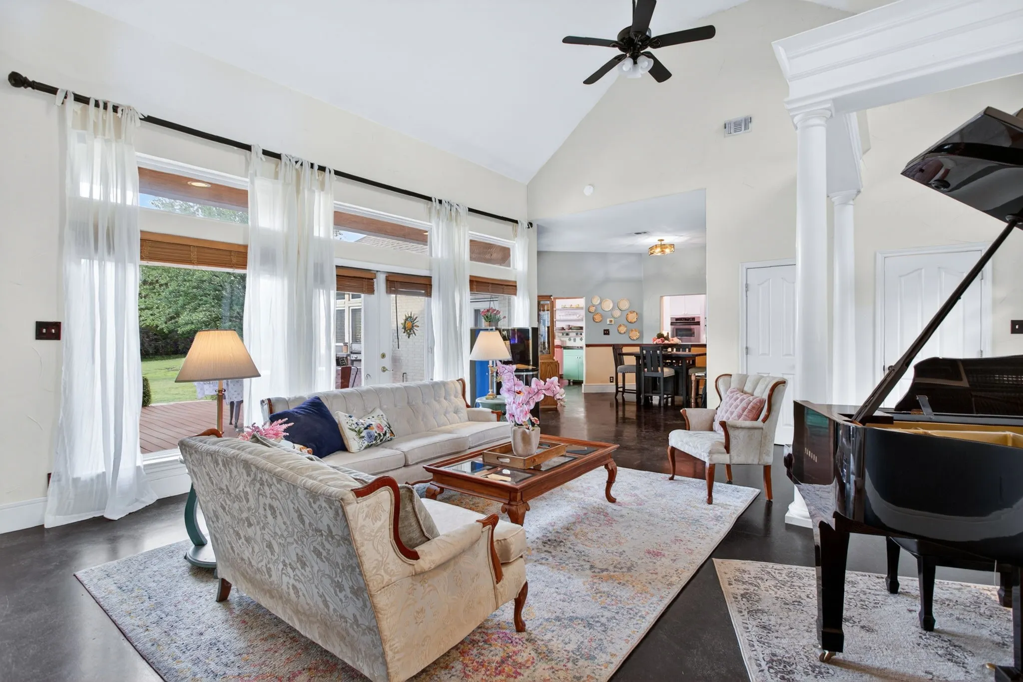 The transom windows add custom detail and bring in extra light; powder bath and coat closet by front door.