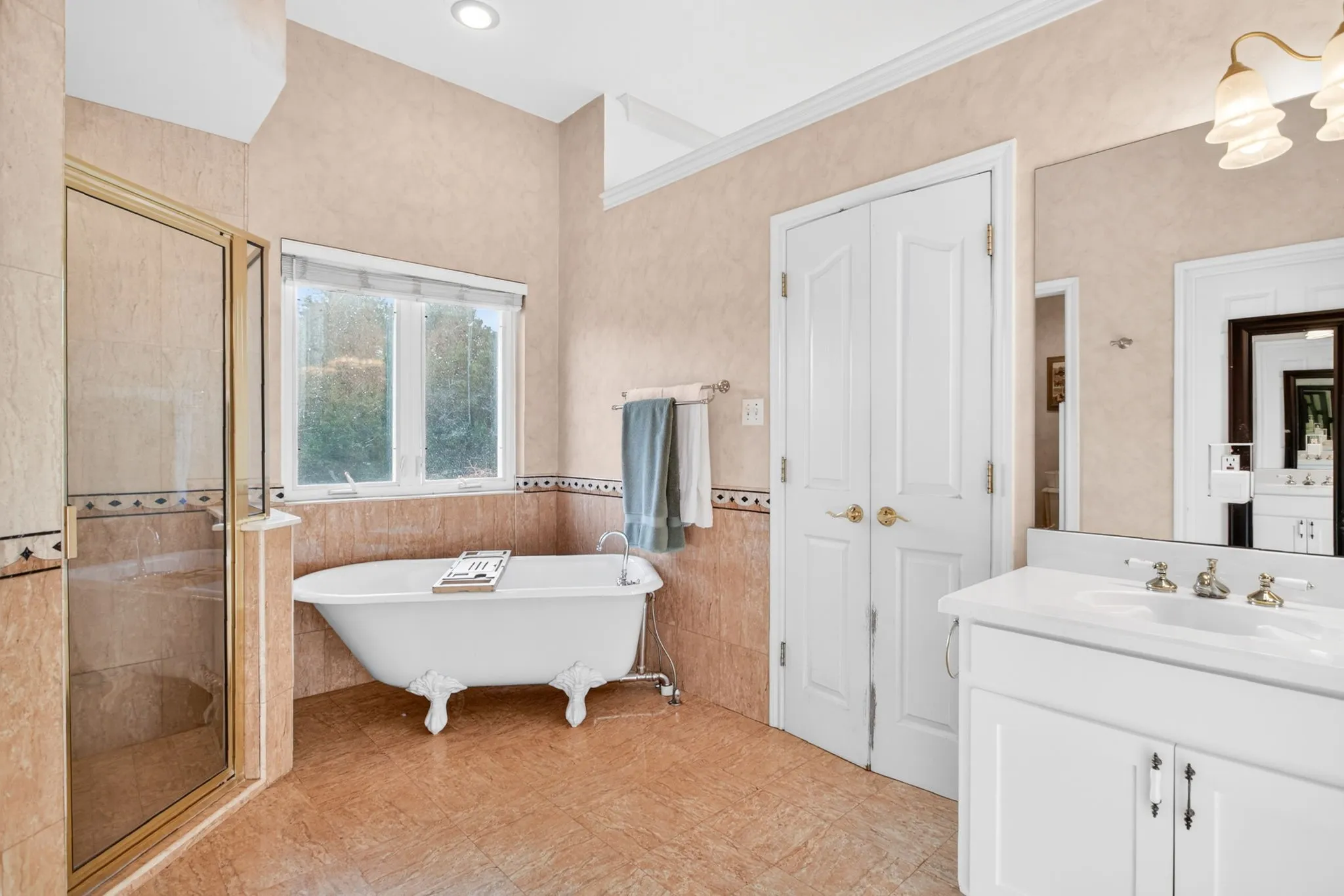 The claw foot stand alone tub is just perfect. Time for relaxation.