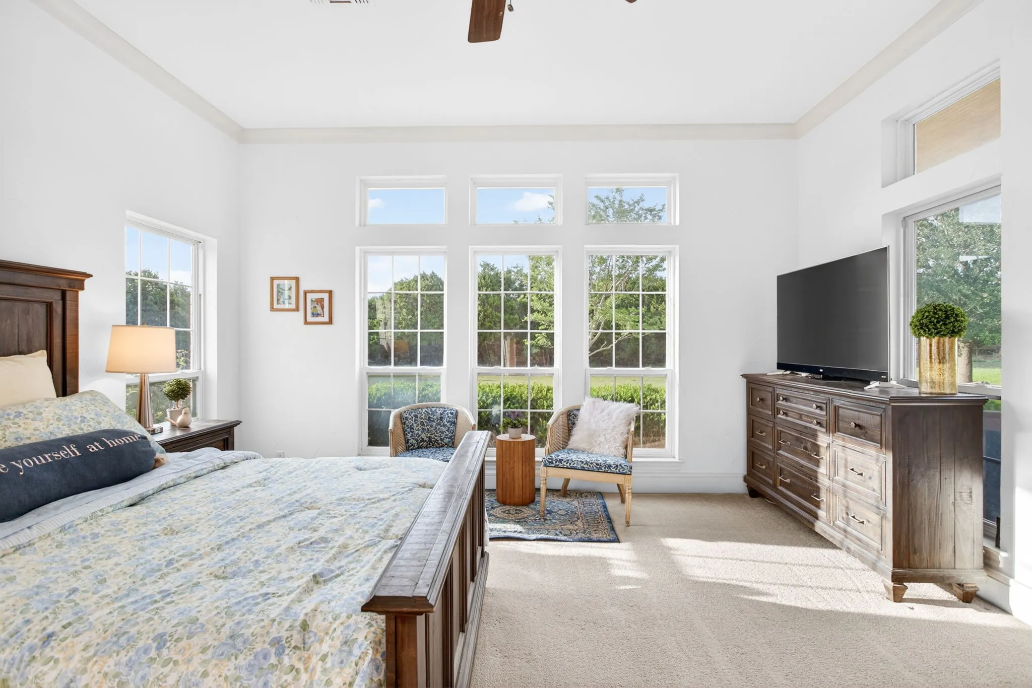 The high ceilings, transom windows and crown molding throughout carry the custom home vibes through every space in the home.